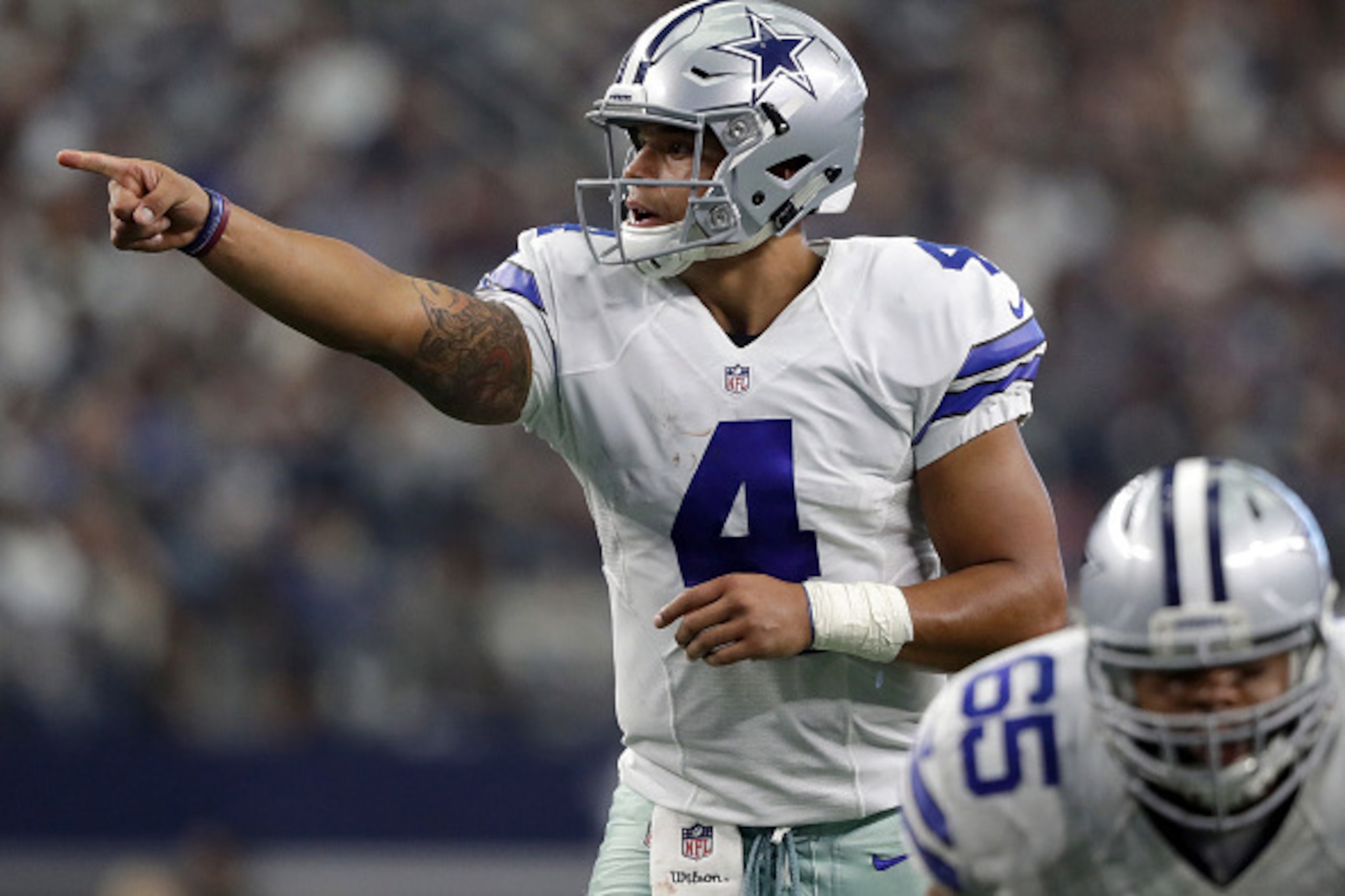 ARLINGTON, TX - NOVEMBER 20: Dak Prescott #4 of the Dallas Cowboys calls a play at the line of scrimmage during the second half against the Baltimore Ravens at AT&T Stadium on November 20, 2016 in Arlington, Texas. (Photo by Ronald Martinez/Getty Image ARLINGTON, TX - NOVEMBER 20: Dak Prescott #4 of the Dallas Cowboys calls a play at the line of scrimmage during the second half against the Baltimore Ravens at AT&T Stadium on November 20, 2016 in Arlington, Texas. (Photo by Ronald Martinez/Getty Image