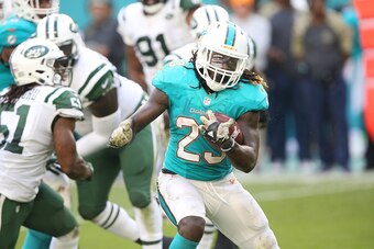 MIAMI GARDENS, FL - NOVEMBER 6: Running Back Jay Ajayi #23 of the Miami Dolphins has a long gain against the New York Jets on November 6, 2016 at Hard Rock Stadium in Miami Gardens, Florida. The Dolphins defeated the Jets 27-23. (Photo by Al Pereira/Getty