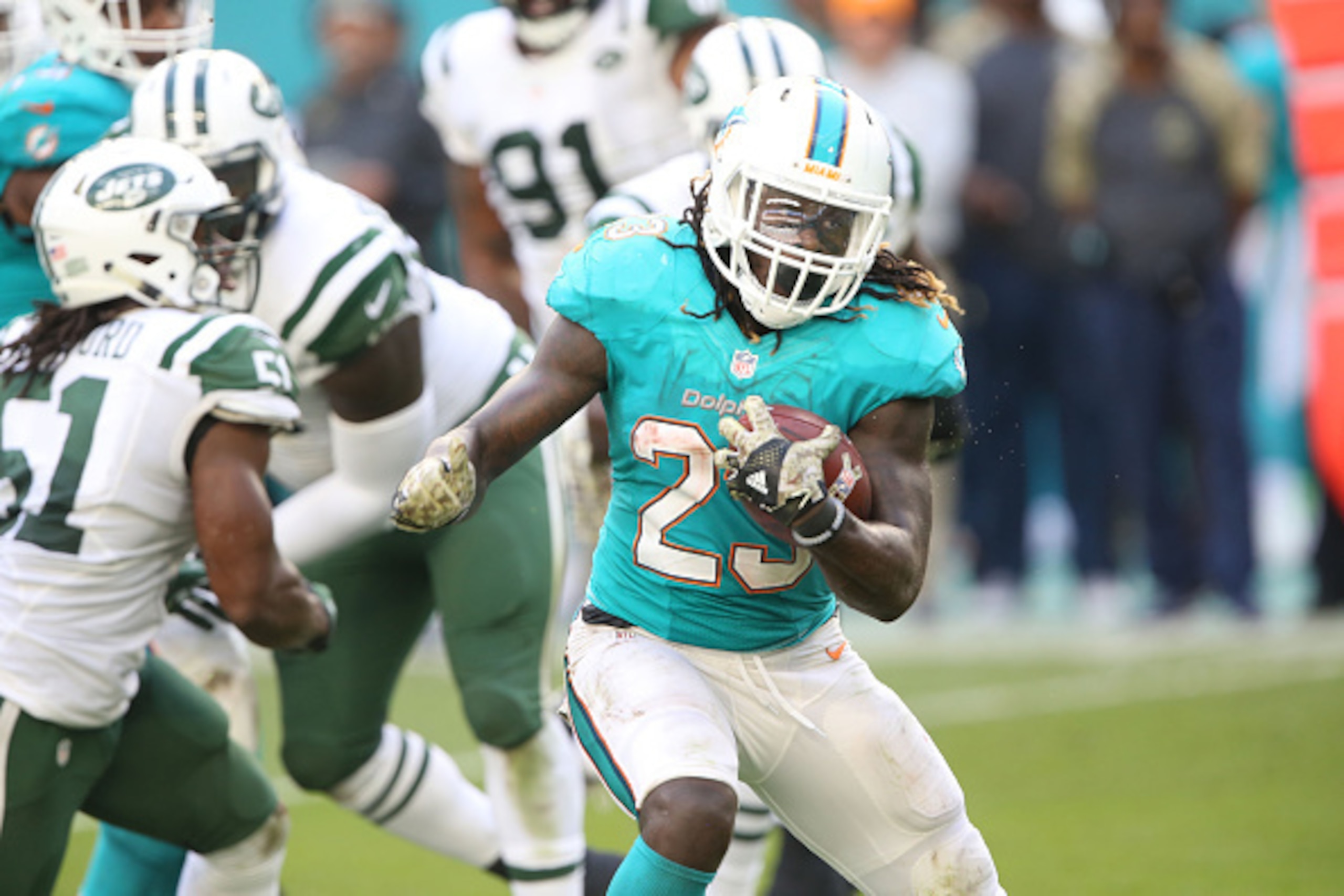 MIAMI GARDENS, FL - NOVEMBER 6: Running Back Jay Ajayi #23 of the Miami Dolphins has a long gain against the New York Jets on November 6, 2016 at Hard Rock Stadium in Miami Gardens, Florida. The Dolphins defeated the Jets 27-23. (Photo by Al Pereira/Getty MIAMI GARDENS, FL - NOVEMBER 6: Running Back Jay Ajayi #23 of the Miami Dolphins has a long gain against the New York Jets on November 6, 2016 at Hard Rock Stadium in Miami Gardens, Florida. The Dolphins defeated the Jets 27-23. (Photo by Al Pereira/Getty