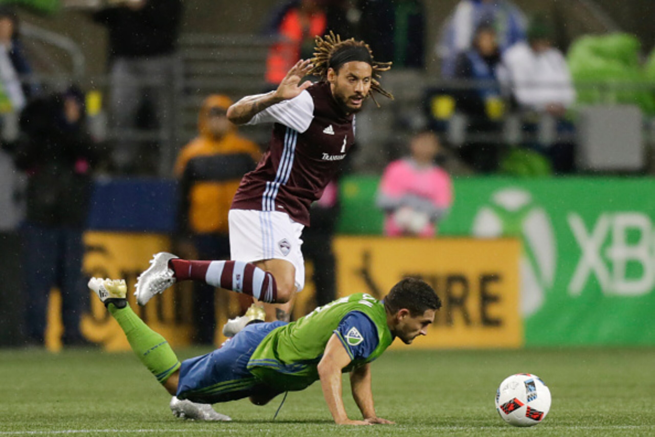SEATTLE, WA - NOVEMBER 22: Cristian Roldan #7 of the Seattle Sounders goes to the ground while fighting for the ball with Jermaine Jones #13, of the Colorado Rapids during the first half of a match in the first leg of the Western Conference Finals at Cent SEATTLE, WA - NOVEMBER 22: Cristian Roldan #7 of the Seattle Sounders goes to the ground while fighting for the ball with Jermaine Jones #13, of the Colorado Rapids during the first half of a match in the first leg of the Western Conference Finals at Cent