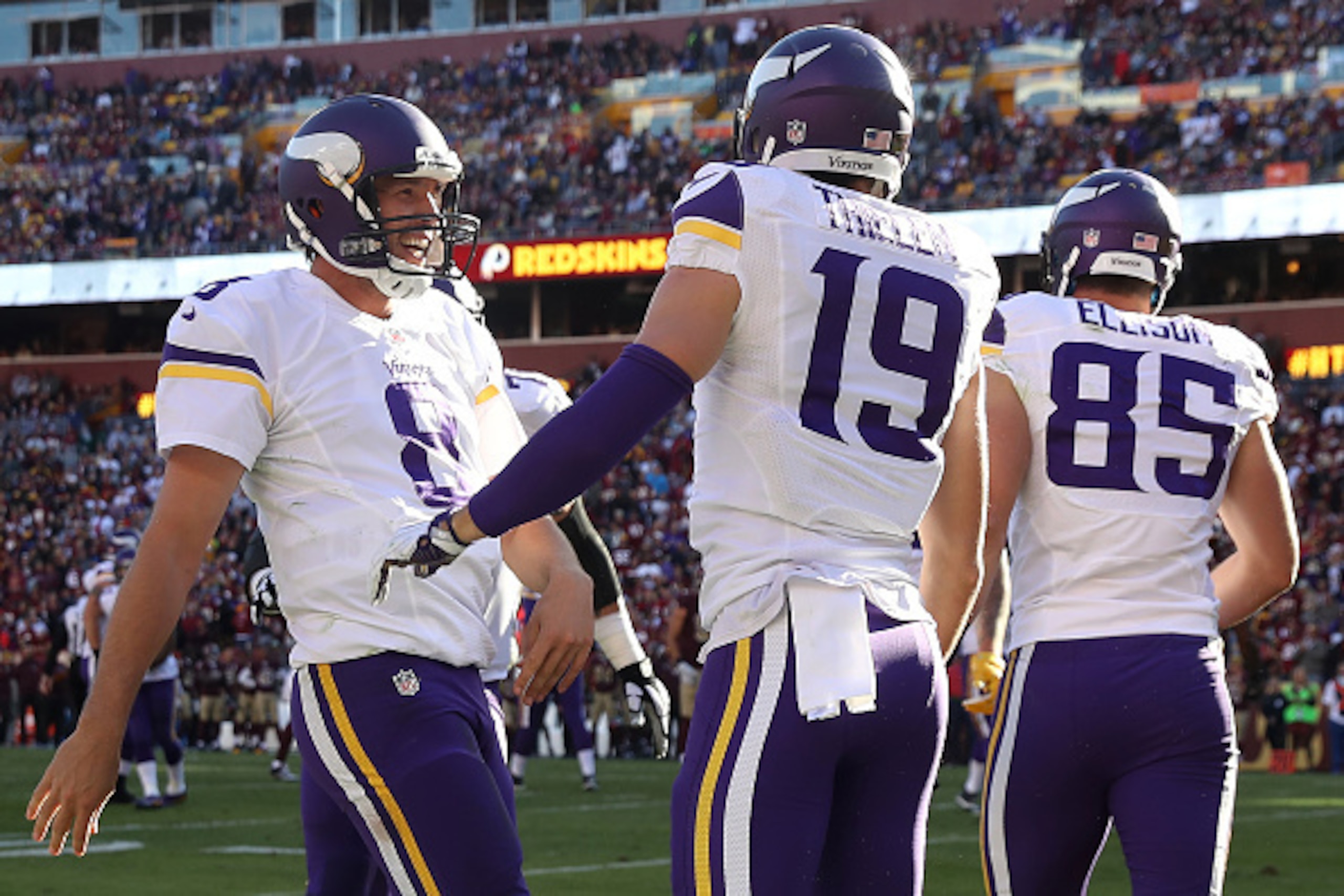 LANDOVER, MD - NOVEMBER 13: Wide receiver Adam Thielen #19 of the Minnesota Vikings celebrates with teammate quarterback Sam Bradford #8 after scoring a second quarter touchdown against the Washington Redskins at FedExField on November 13, 2016 in Landove