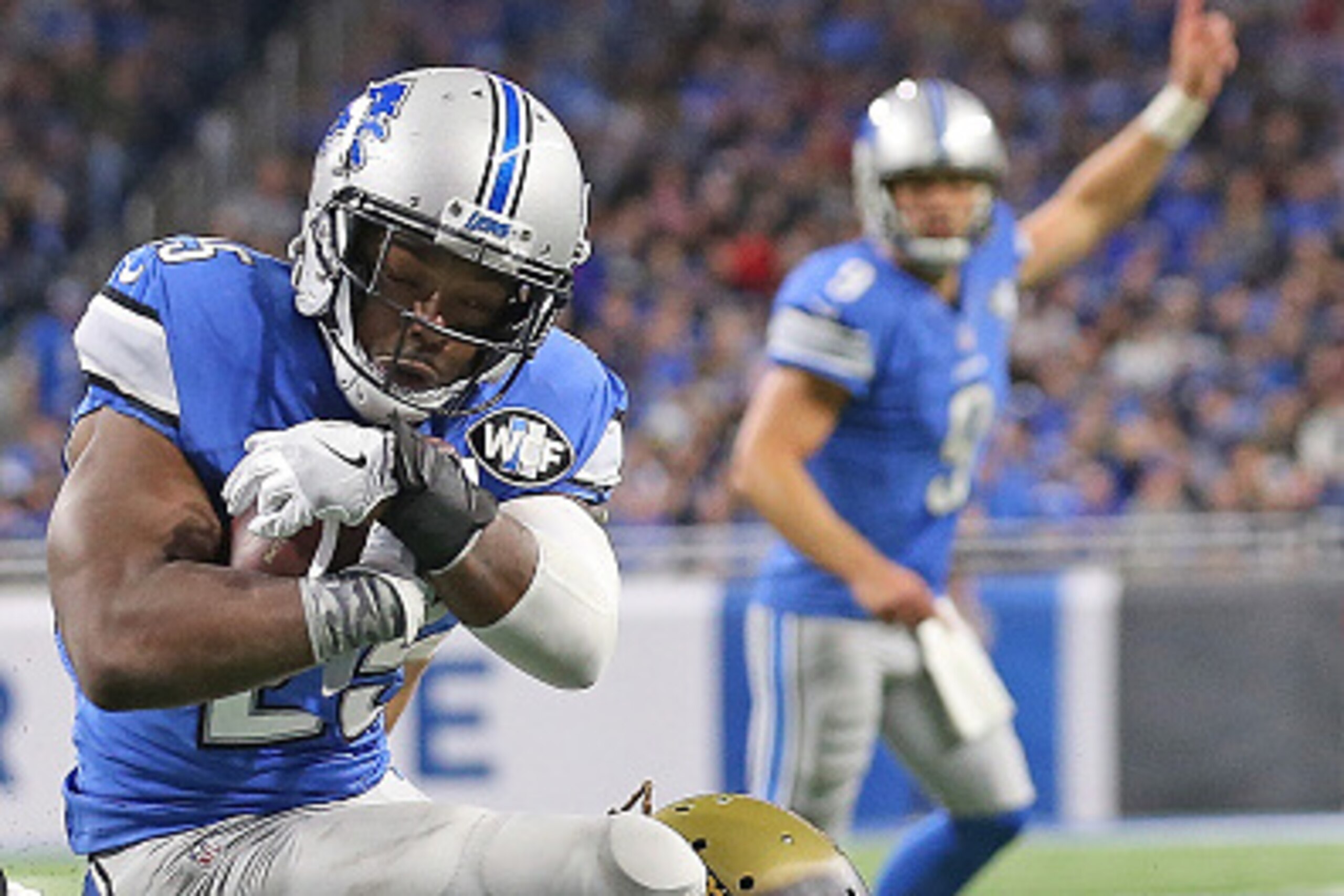 DETROIT, MI - NOVEMBER 20: Theo Riddick #25 of the Detroit Lions runs the ball to the one yard line as Patrick Omameh #77 of the Jacksonville Jaguars makes the stop during the fourth quarter of the game at Ford Field on November 20, 2016 in Detroit, Michi
