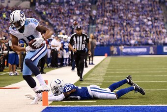 INDIANAPOLIS, IN - NOVEMBER 20:  Rishard Matthews #18 of the Tennessee Titans catches a pass in front of Darius Butler #20 of the Indianapolis Colts during the first half of a game at Lucas Oil Stadium on November 20, 2016 in Indianapolis, Indiana.  (Phot