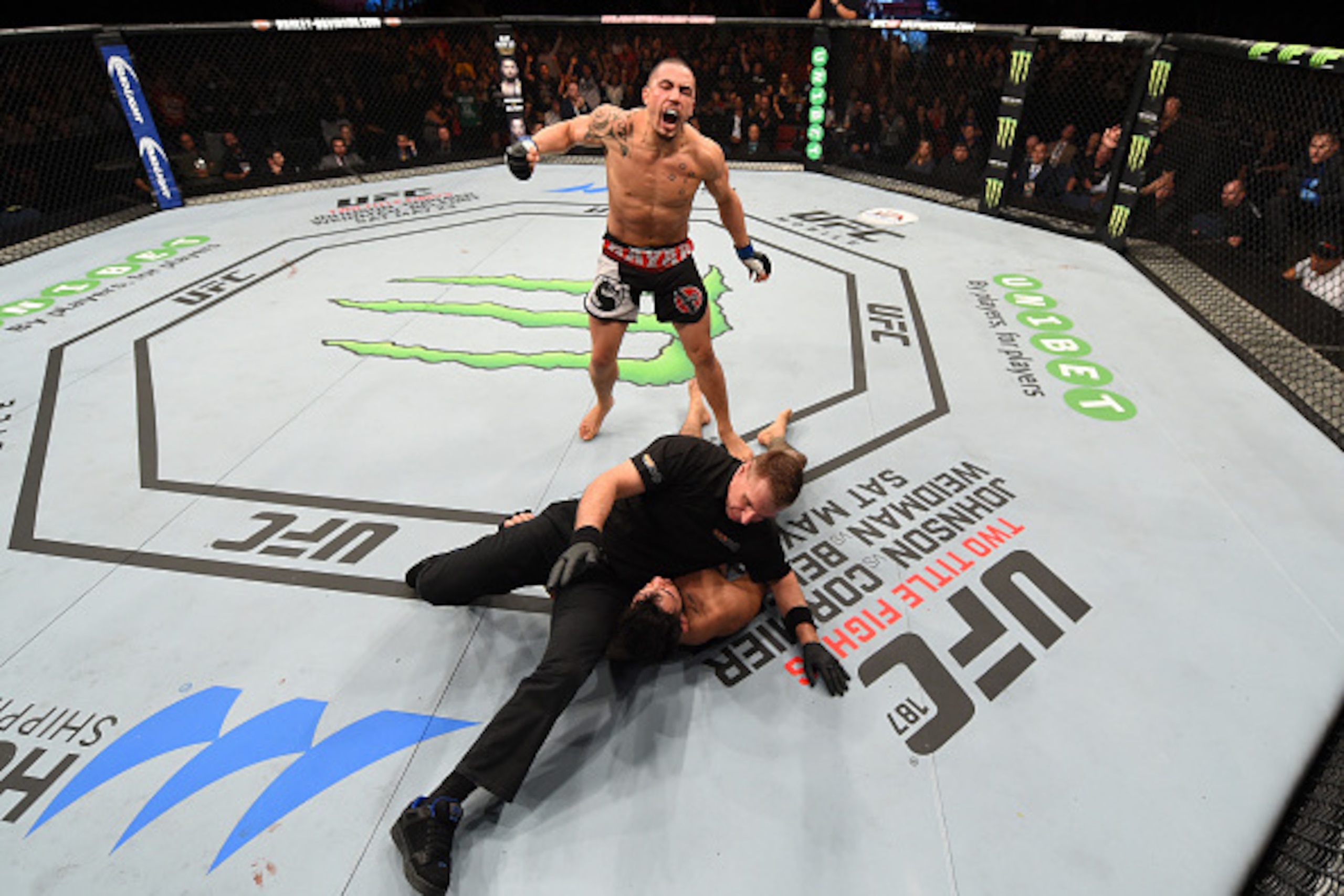 ADELAIDE, AUSTRALIA - MAY 10:   Robert Whittaker celebrates his knockout victory over Brad Tavares in their middleweight bout during the UFC Fight Night event at the Adelaide Entertainment Centre on May 10, 2015 in Adelaide, Australia. (Photo by Josh Hedg
