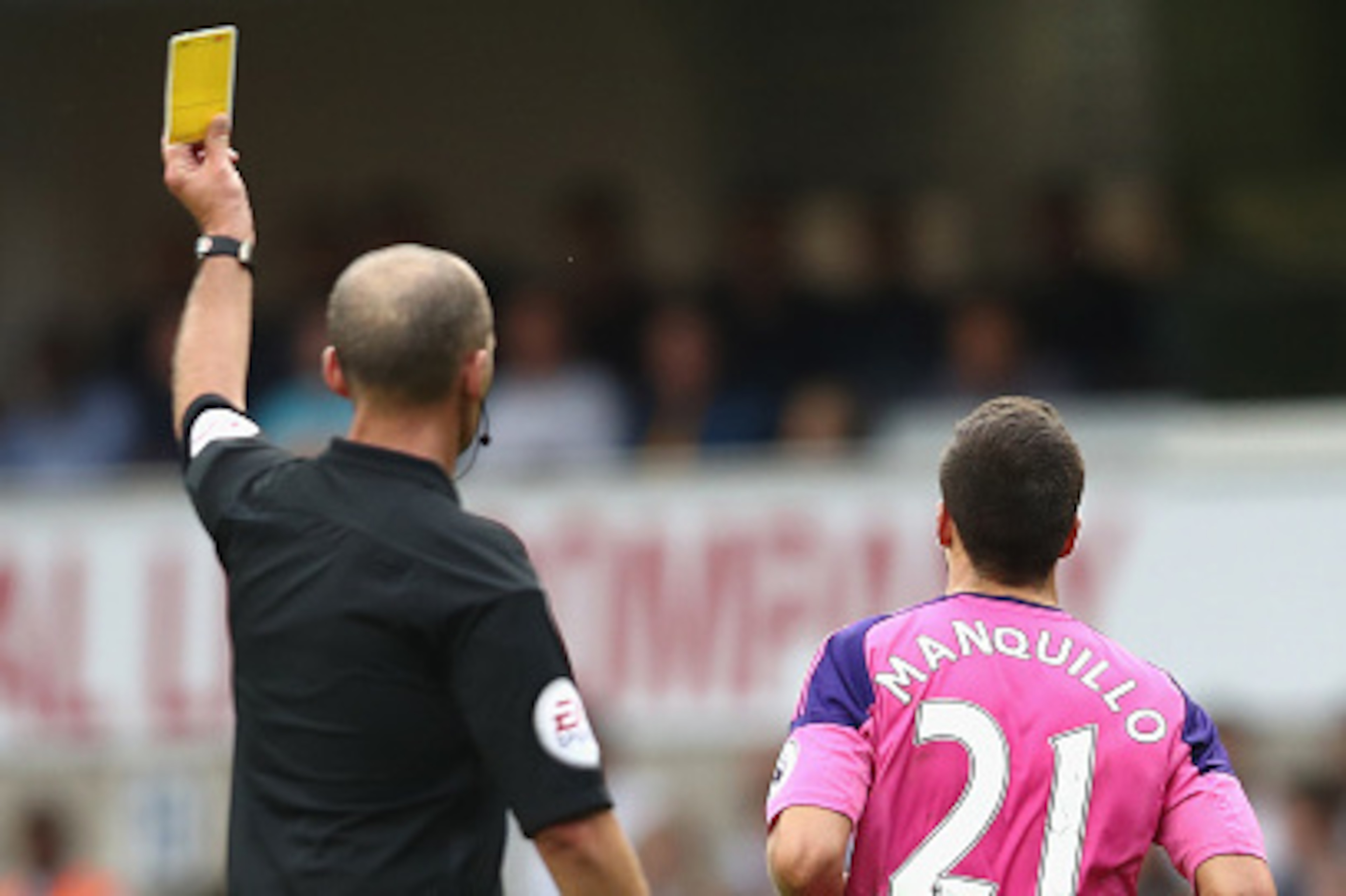 LONDON, ENGLAND - SEPTEMBER 18: Mike Dean gives Javier Manquillo of Sunderland a yellow card during the Premier League match between Tottenham Hotspur and Sunderland at White Hart Lane on September 18, 2016 in London, England. (Photo by Julian Finney/Ge LONDON, ENGLAND - SEPTEMBER 18: Mike Dean gives Javier Manquillo of Sunderland a yellow card during the Premier League match between Tottenham Hotspur and Sunderland at White Hart Lane on September 18, 2016 in London, England. (Photo by Julian Finney/Ge