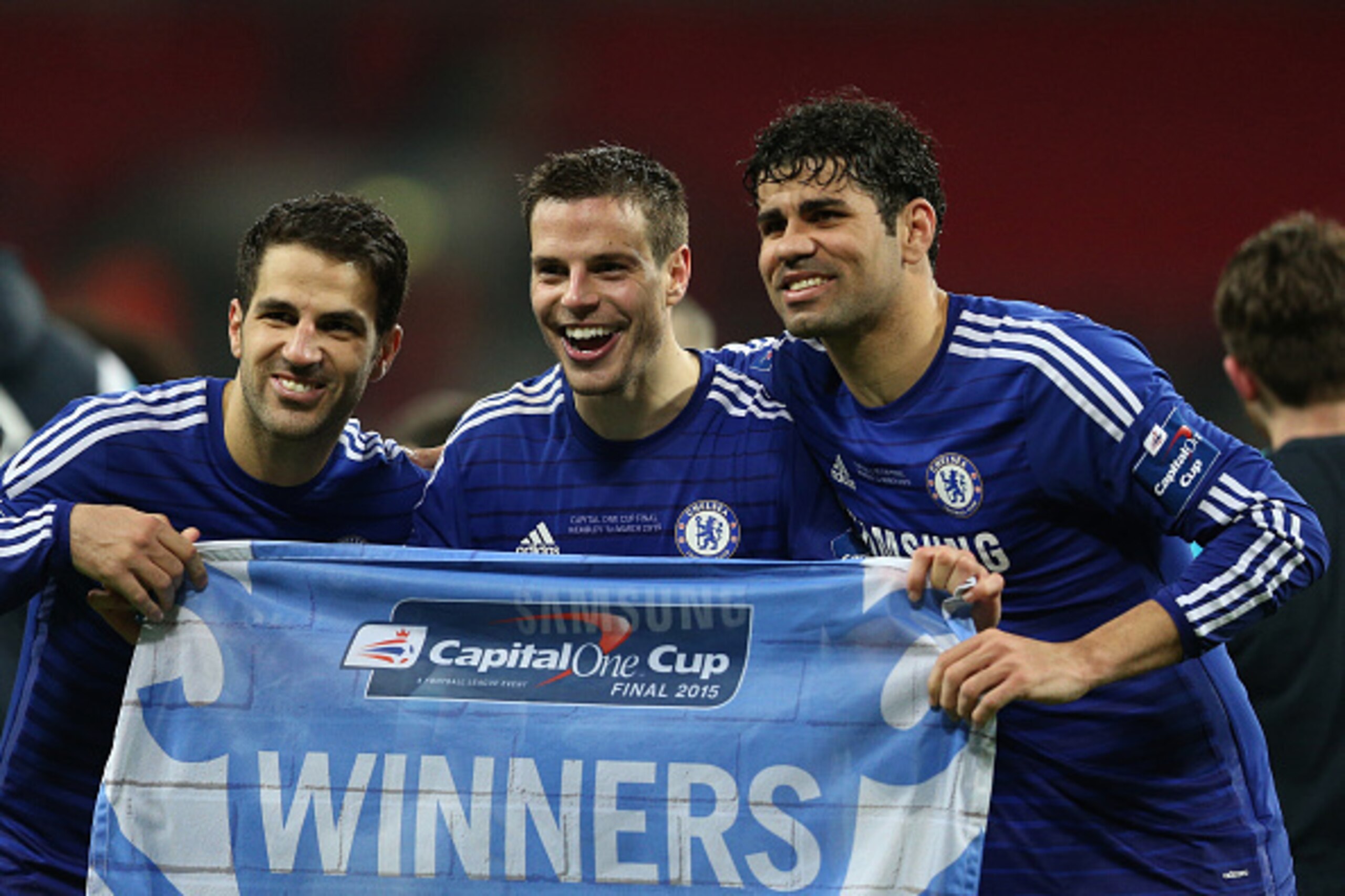 LONDON, ENGLAND - MARCH 01: (L-R) Cesc Fabregas, Cesar Azpilicueta and Diego Costa of Chelsea celebrate during the Capital One Cup Final match between Chelsea and Tottenham Hotspur at Wembley Stadium on March 1, 2015 in London, England.  (Photo by Clive M