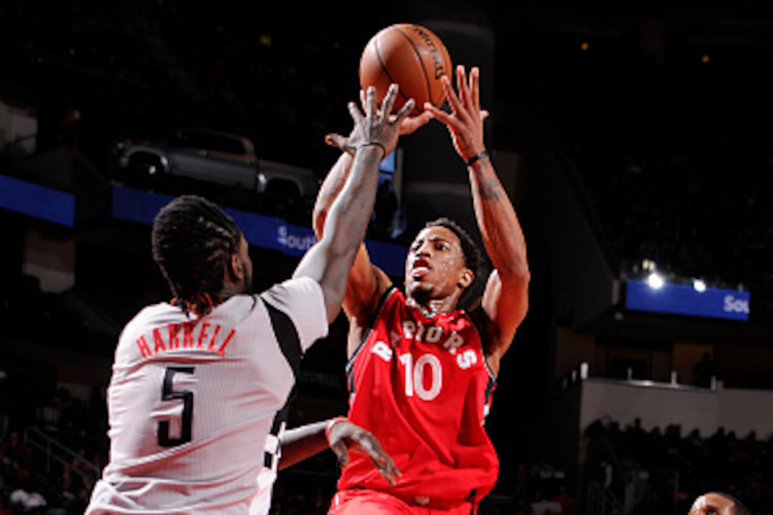 HOUSTON, TX - NOVEMBER 23:  DeMar DeRozan #10 of the Toronto Raptors shoots the ball over Montrezl Harrell #5 of the Houston Rockets on November 23, 2016 at the Toyota Center in Houston, Texas. NOTE TO USER: User expressly acknowledges and agrees that, by