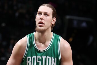 BROOKLYN, NY - NOVEMBER 23: Kelly Olynyk #41 of the Boston Celtics shoots a free throw against the Brooklyn Nets on November 23, 2016 at Barclays Center in Brooklyn, New York. NOTE TO USER: User expressly acknowledges and agrees that, by downloading and o