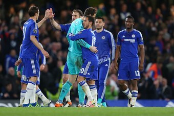 LONDON, ENGLAND - MAY 02 :  Eden Hazard of Chelsea hugs Asmir Begovic of Chelsea as the team celebrate after the Barclays Premier League match between Chelsea and Tottenham Hotspur at Stamford Bridge on May 2, 2016 in London, England.  (Photo by Catherine