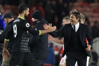 Chelsea's Italian head coach Antonio Conte (R) reacts as he congratulates Chelsea's Brazilian-born Spanish striker Diego Costa following the English Premier League football match between Middlesbrough and Cheslea at Riverside Stadium in Middlesbrough, nor