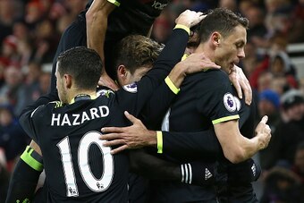 MIDDLESBROUGH, ENGLAND - NOVEMBER 20:  Diego Costa of Chelsea is mobbed by team mates including Cesar Azpilicueta (top) after scoring the opening goal during the Premier League match between Middlesbrough and Chelsea at Riverside Stadium on November 20, 2