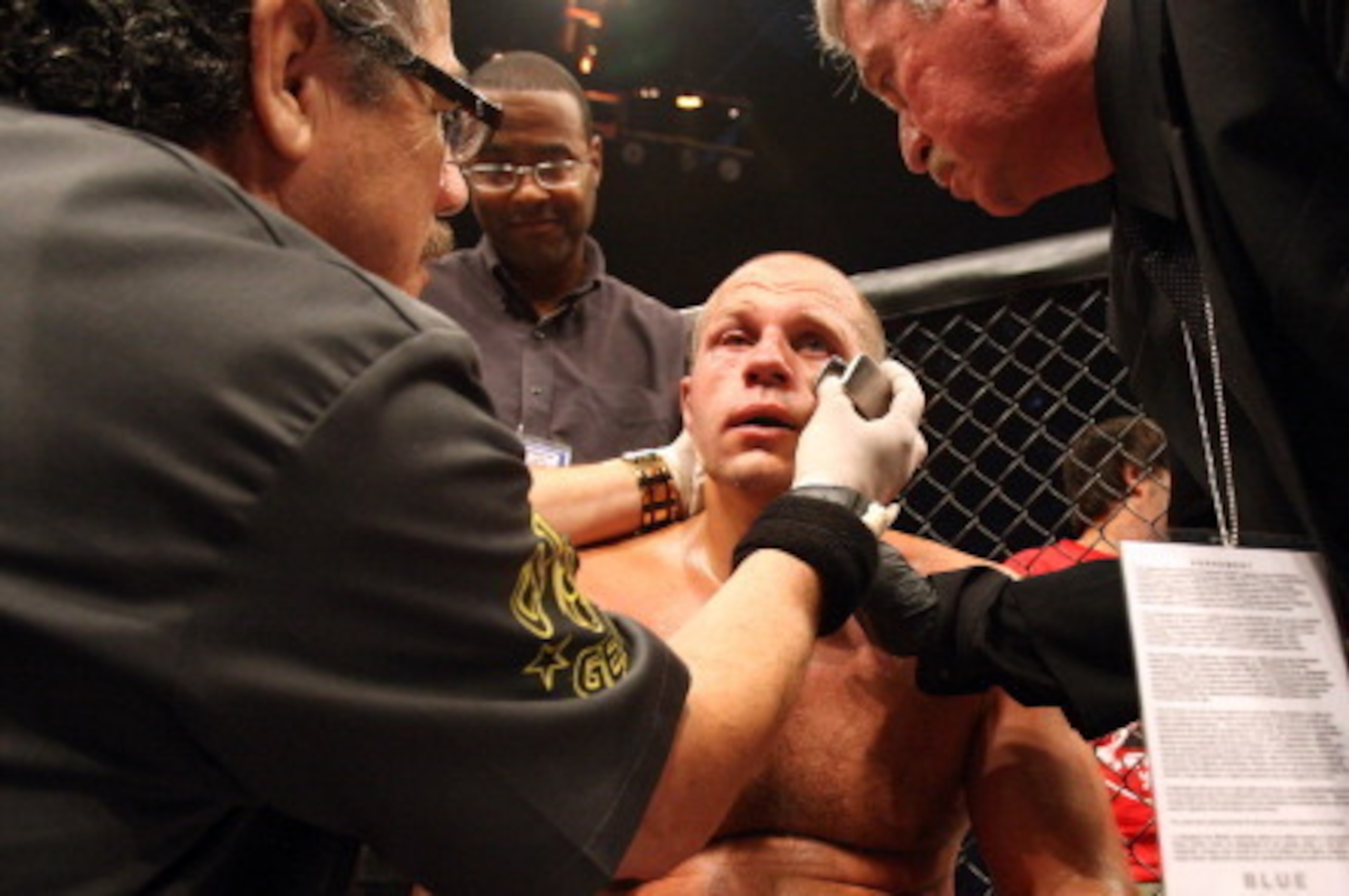 HOFFMAN ESTATES, IL - JULY 30: Fedor Emelianenko receives attention from his cut man after suffering a TKO loss to Dan Henderson in a heavyweight fight at the Strikeforce event at Sears Centre Arena on July 30, 2011 in Hoffman Estates, Illinois. (Photo HOFFMAN ESTATES, IL - JULY 30: Fedor Emelianenko receives attention from his cut man after suffering a TKO loss to Dan Henderson in a heavyweight fight at the Strikeforce event at Sears Centre Arena on July 30, 2011 in Hoffman Estates, Illinois. (Photo