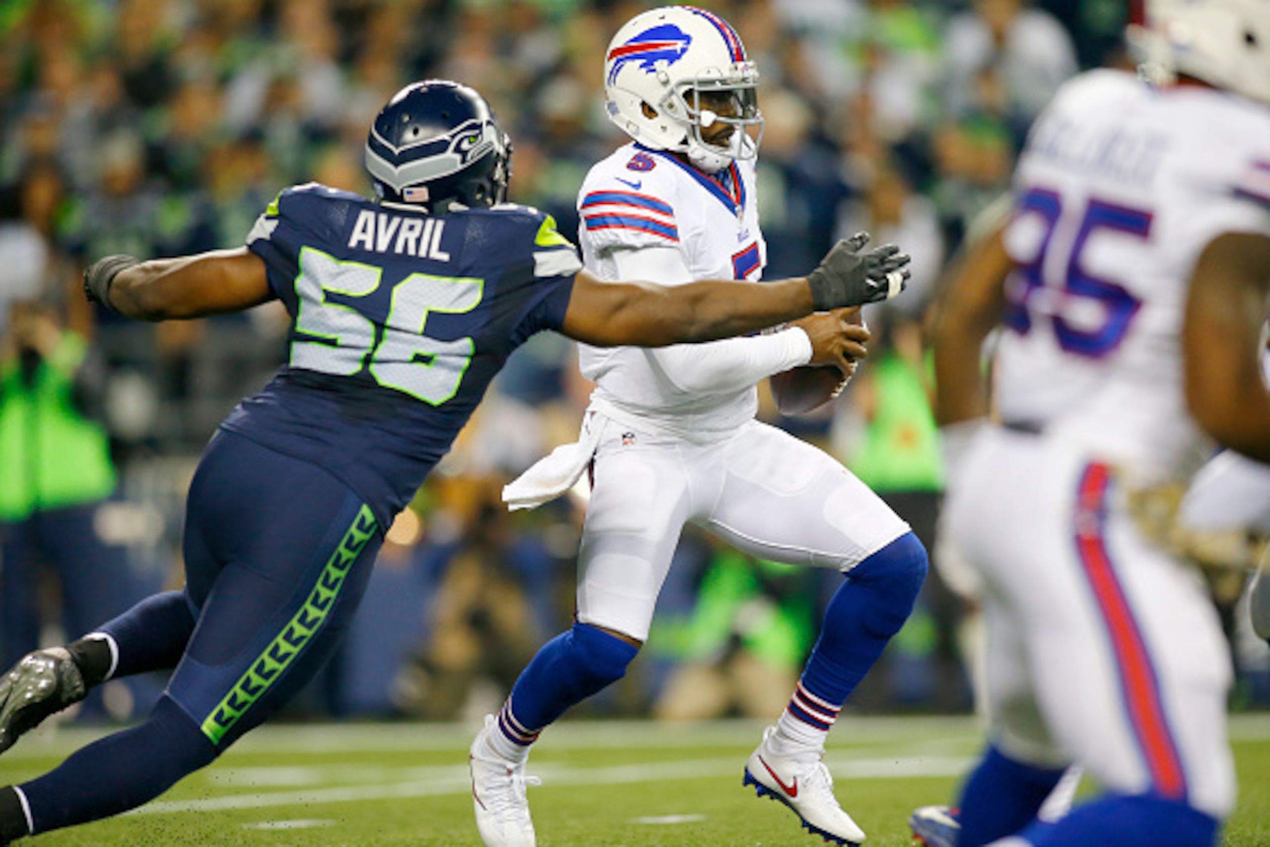 SEATTLE, WA - NOVEMBER 07:  Quarterback Tyrod Taylor #5 of the Buffalo Bills tries to evade defensive end Cliff Avril #56 of the Seattle Seahawks at CenturyLink Field on November 7, 2016 in Seattle, Washington.  (Photo by Jonathan Ferrey/Getty Images)