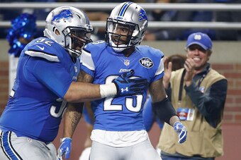 DETROIT.MI - NOVEMBER 24: Darius Slay #23 of the Detroit Lions celebrates with Haloti Ngata (92) of the Detroit Lions after intercepting a pass with 30 seconds left in the fourth quarter at Ford Field on November 24, 2016 in Detroit, Michigan. The Lions k