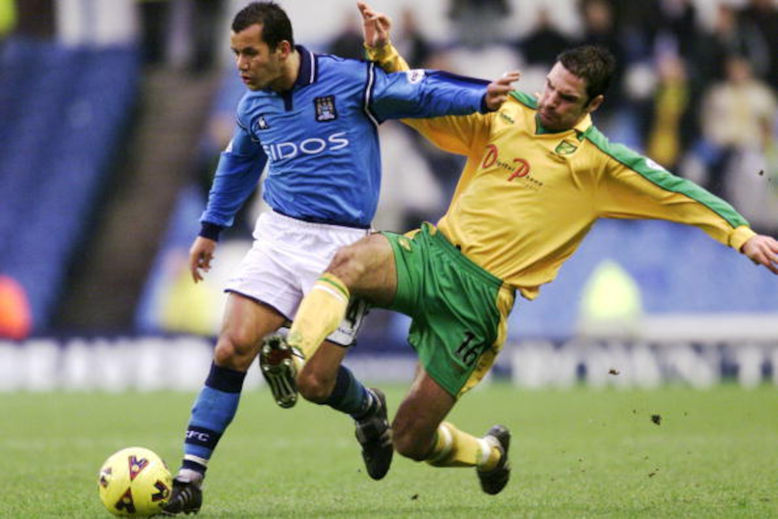 13 Jan 2002:  Ali Benarbia of Manchester City takes the ball past Steen Nedergaard of Norwich City during the Nationwide League Division One match played at Maine Road, in Manchester, England. Manchester City won the match 3-1. DIGITAL IMAGE. Mandatory Cr