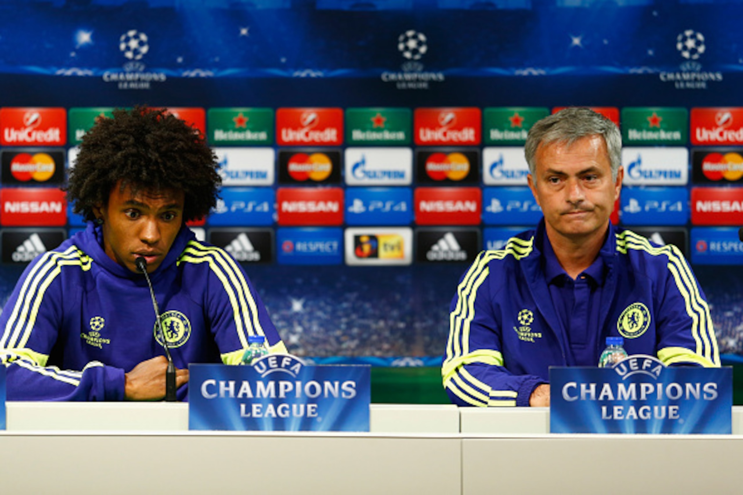 LISBON, PORTUGAL - SEPTEMBER 29:  Willian of Chelsea and Jose Mourinho, coach of Chelsea talk to the media during a press conference at Estadio Jose Alvalade on September 29, 2014 in Lisbon, Portugal.  (Photo by Julian Finney/Getty Images)