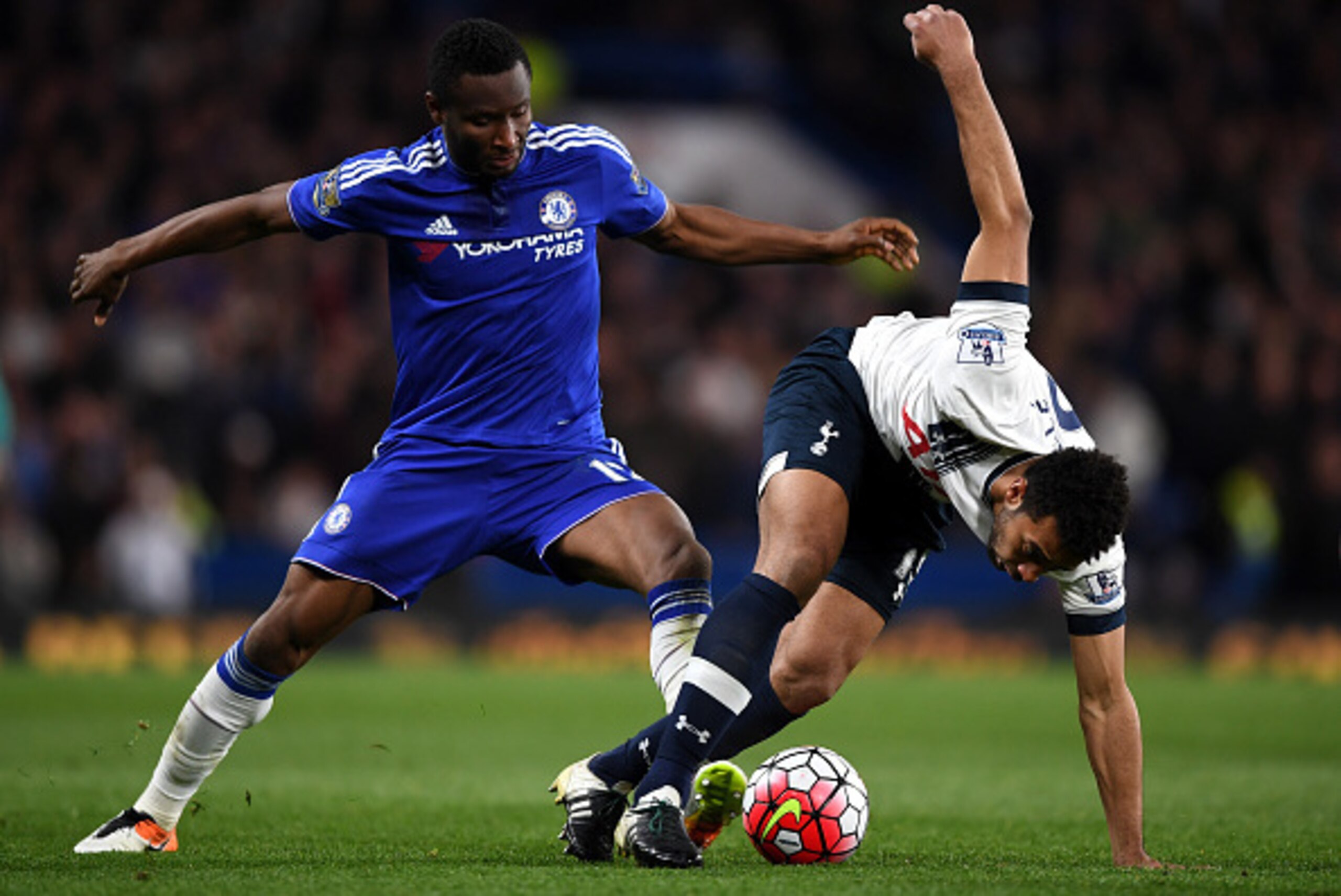LONDON, ENGLAND - MAY 02:  Mousa Dembele of Tottenham Hotspur is brought down by John Mikel Obi of Chelsea during the Barclays Premier League match between Chelsea and Tottenham Hotspur at Stamford Bridge on May 02, 2016 in London, England.jd  (Photo by S