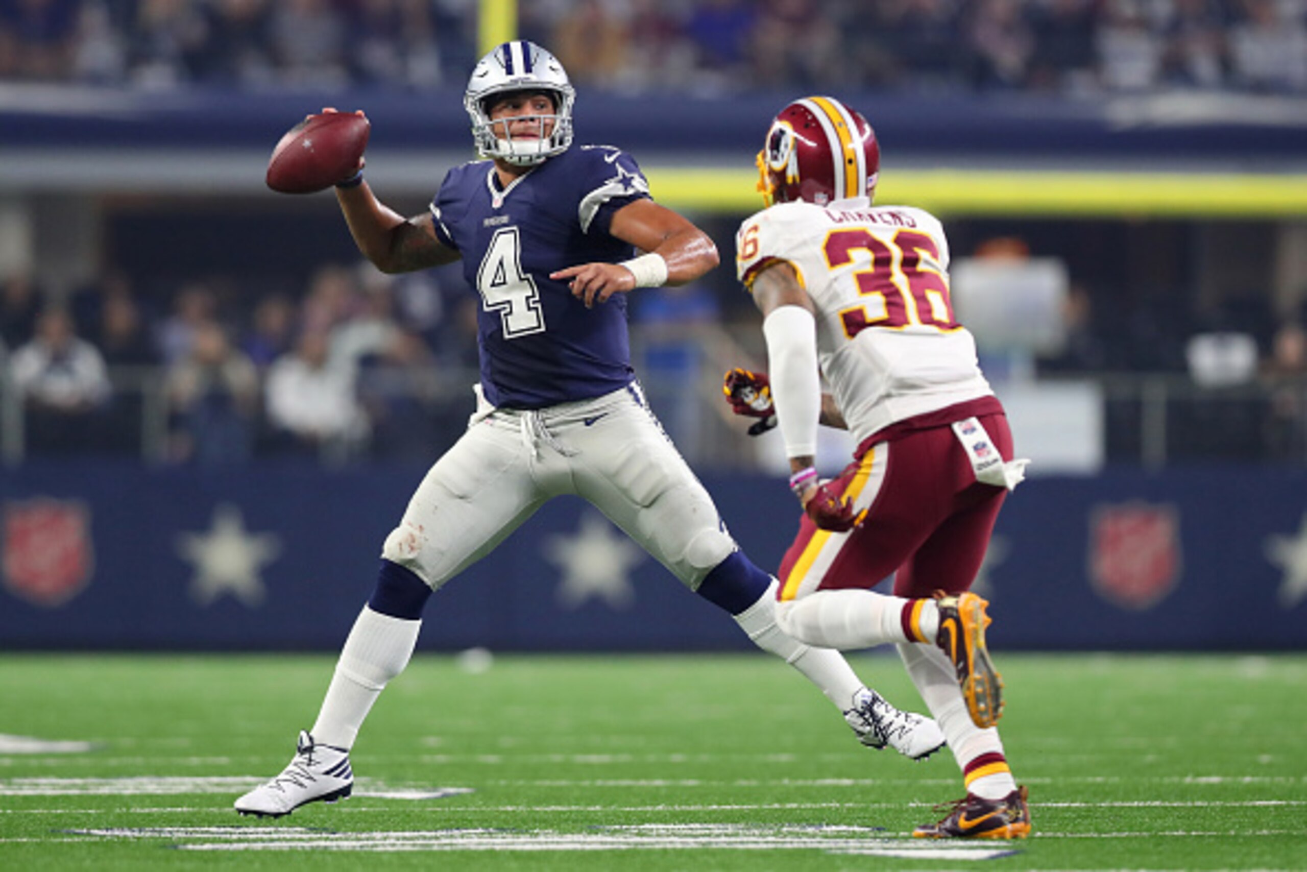 ARLINGTON, TX - NOVEMBER 24: Dak Prescott #4 of the Dallas Cowboys rolls out to pass during the fourth quarter against the Washington Redskins at AT&T Stadium on November 24, 2016 in Arlington, Texas. (Photo by Tom Pennington/Getty Images) ARLINGTON, TX - NOVEMBER 24: Dak Prescott #4 of the Dallas Cowboys rolls out to pass during the fourth quarter against the Washington Redskins at AT&T Stadium on November 24, 2016 in Arlington, Texas. (Photo by Tom Pennington/Getty Images)