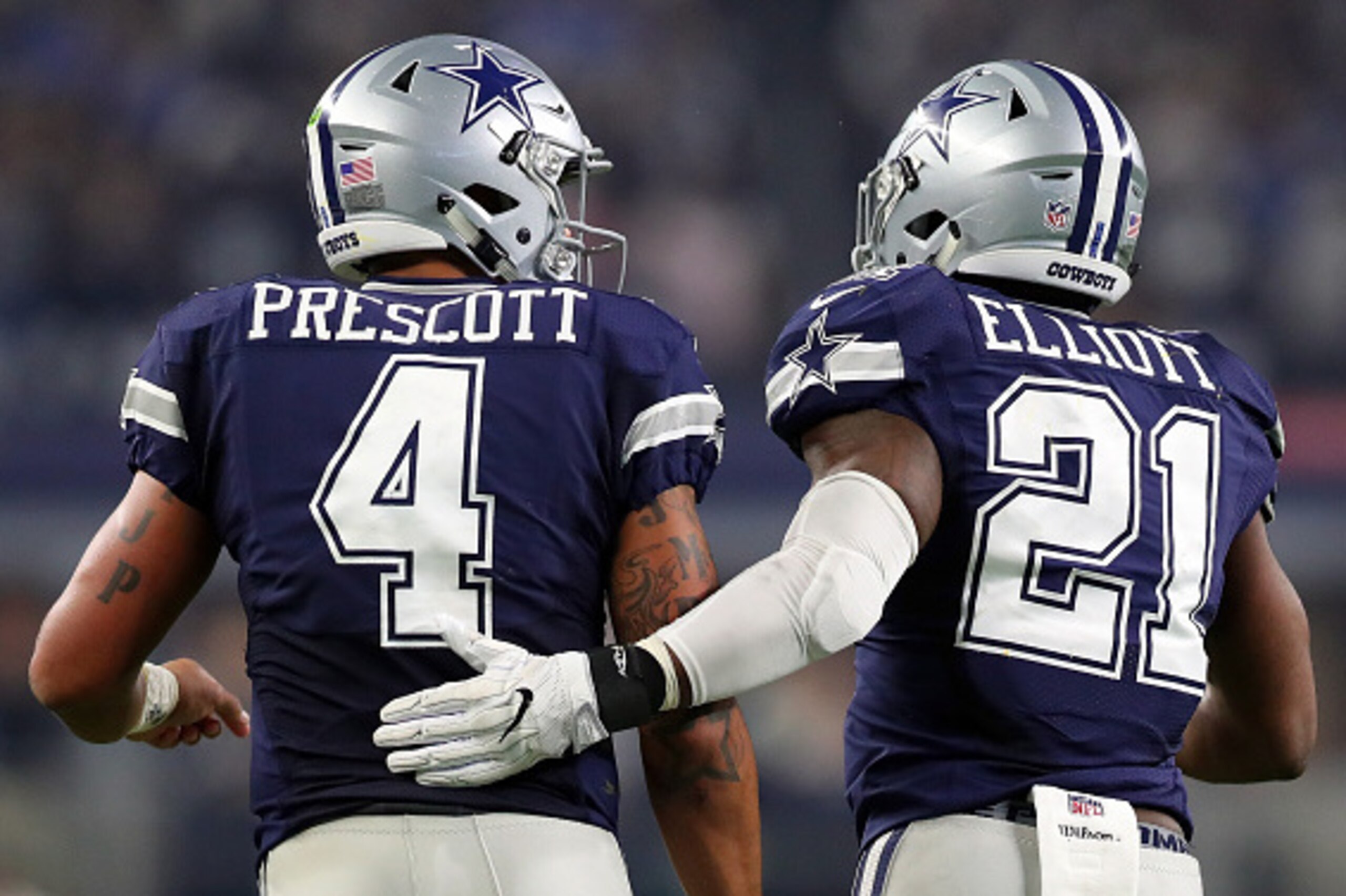 ARLINGTON, TX - NOVEMBER 24: Dak Prescott #4 of the Dallas Cowboys celebrates with Ezekiel Elliott #21 after scoring a touchdown during the fourth quarter against the Washington Redskins at AT&T Stadium on November 24, 2016 in Arlington, Texas. (Photo ARLINGTON, TX - NOVEMBER 24: Dak Prescott #4 of the Dallas Cowboys celebrates with Ezekiel Elliott #21 after scoring a touchdown during the fourth quarter against the Washington Redskins at AT&T Stadium on November 24, 2016 in Arlington, Texas. (Photo