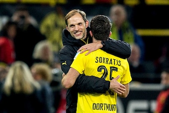 DORTMUND, GERMANY - NOVEMBER 19:  Head coach Thomas Tuchel of Borussia Dortmund hugs Sokratis Papastathopoulos of Borussia Dortmund after winning the Bundesliga match between Borussia Dortmund and Bayern Muenchen at Signal Iduna Park on November 19, 2016 