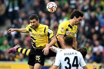 Dortmund's defender Mats Hummels and Dortmund's Greek defender Sokratis vie for the ball during the German first division Bundesliga football match between Borussia Moenchengladbach v Borussia Dortmund in Moenchengladbach, Germany, on April 11, 2015.  AFP