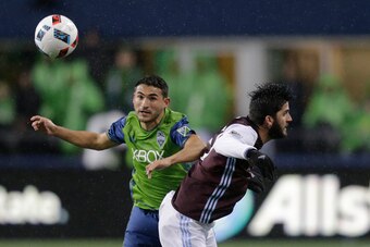 SEATTLE, WA - NOVEMBER 22: Cristian Roldan #7, left, of the Seattle Sounders battles, Eric Miller #3 of the Colorado Rapids for the ball during the second half of a match in the first leg of the Western Conference Finals at CenturyLink Field on November 2