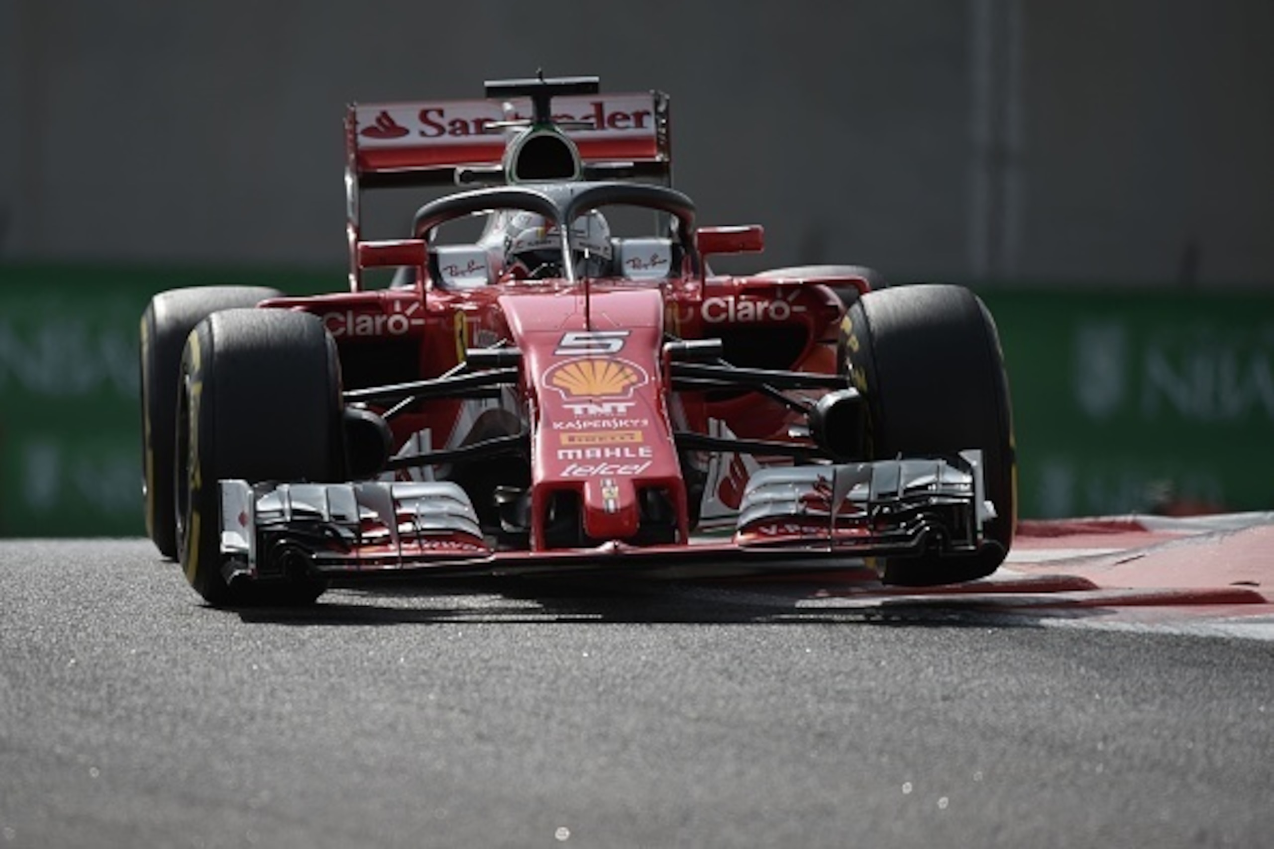 Scuderia Ferrari's driver Sebastian Vettel steers his car during the first practice session as part of the Abu Dhabi Formula One Grand Prix at the Yas Marina circuit on November 25, 2016. / AFP / MOHAMMED AL-SHAIKH        (Photo credit should read MOHAMME