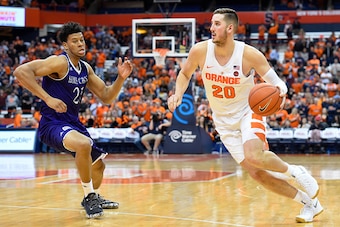 SYRACUSE, NY - NOVEMBER 15:  Tyler Lydon #20 of the Syracuse Orange drives to the basket around Malachi Alexander #21 of the Holy Cross Crusaders during the second half at the Carrier Dome on November 15, 2016 in Syracuse, New York. Syracuse defeated Holy