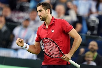 Croatia's Marin Cilic reacts after scoring against Argentina's Federico Delbonis during the Davis Cup World Group final singles match between Croatia and Argentina at the Arena hall in Zagreb, on November 25, 2016. / AFP / STRINGER        (Photo credit sh