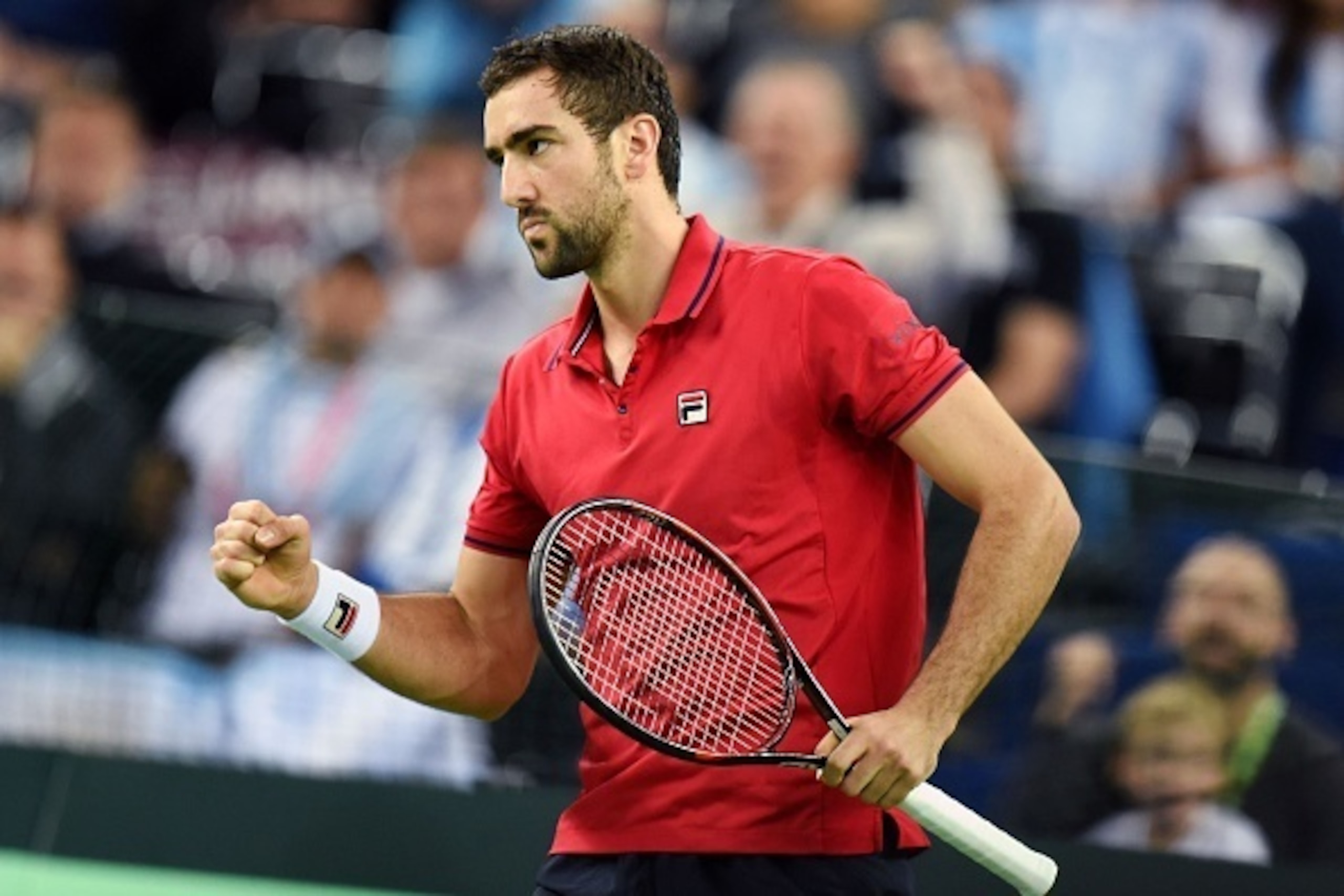 Croatia's Marin Cilic reacts after scoring against Argentina's Federico Delbonis during the Davis Cup World Group final singles match between Croatia and Argentina at the Arena hall in Zagreb, on November 25, 2016. / AFP / STRINGER (Photo credit sh Croatia's Marin Cilic reacts after scoring against Argentina's Federico Delbonis during the Davis Cup World Group final singles match between Croatia and Argentina at the Arena hall in Zagreb, on November 25, 2016. / AFP / STRINGER (Photo credit sh