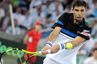 Argentina's Federico Delbonis returns ball to Croatia's Marin Cilic during the Davis Cup World Group final singles match between Croatia and Argentina at the Arena hall in Zagreb, on November 25, 2016. / AFP / STRINGER        (Photo credit should read STR