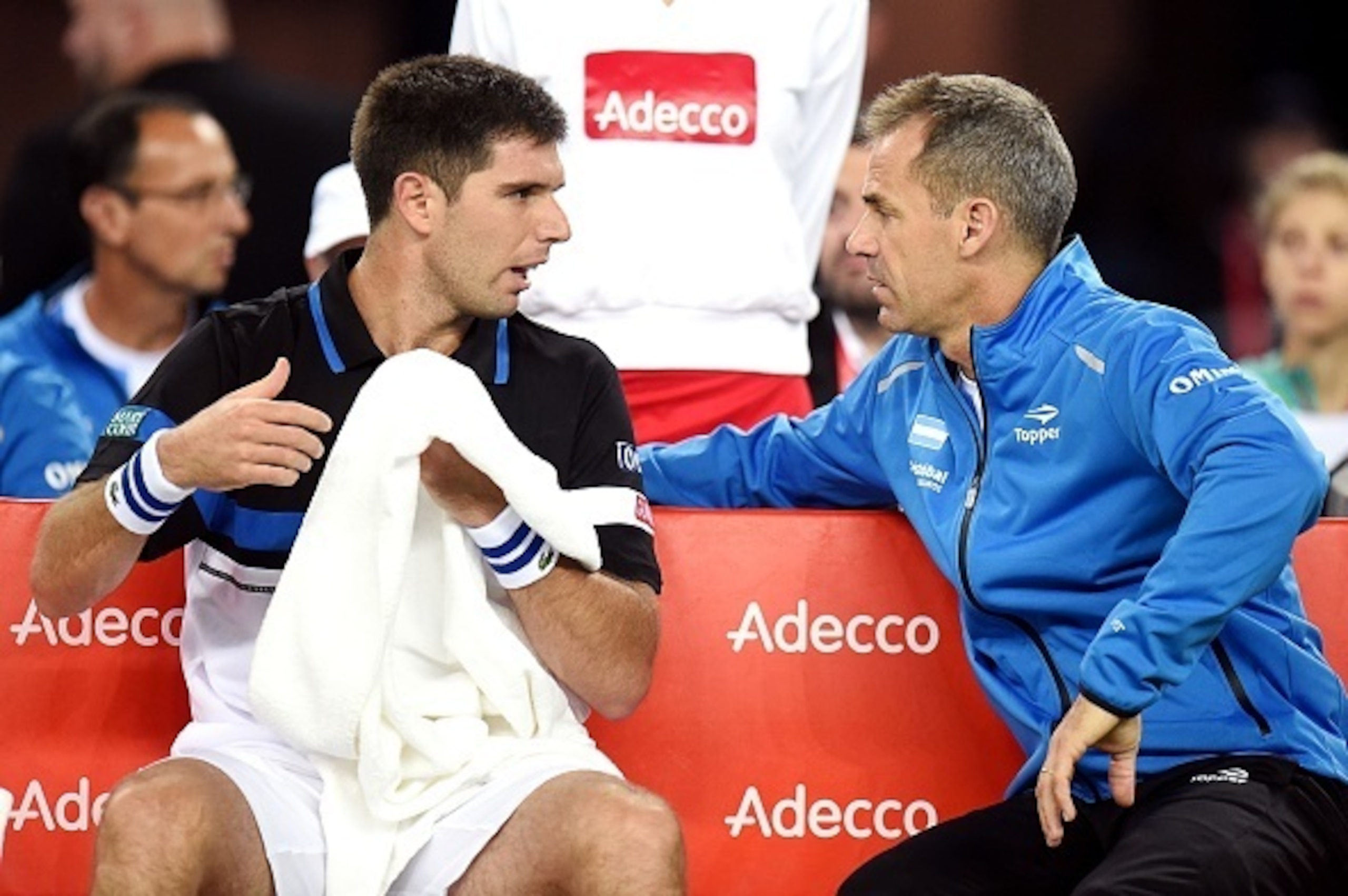 Argentina's Federico Delbonis (L) talks with head coach of Argentinian team Daniel Orsanic during a break time as part of the Davis Cup World Group final singles match between Croatia and Argentina at the Arena hall in Zagreb, on November 25, 2016. / AFP Argentina's Federico Delbonis (L) talks with head coach of Argentinian team Daniel Orsanic during a break time as part of the Davis Cup World Group final singles match between Croatia and Argentina at the Arena hall in Zagreb, on November 25, 2016. / AFP