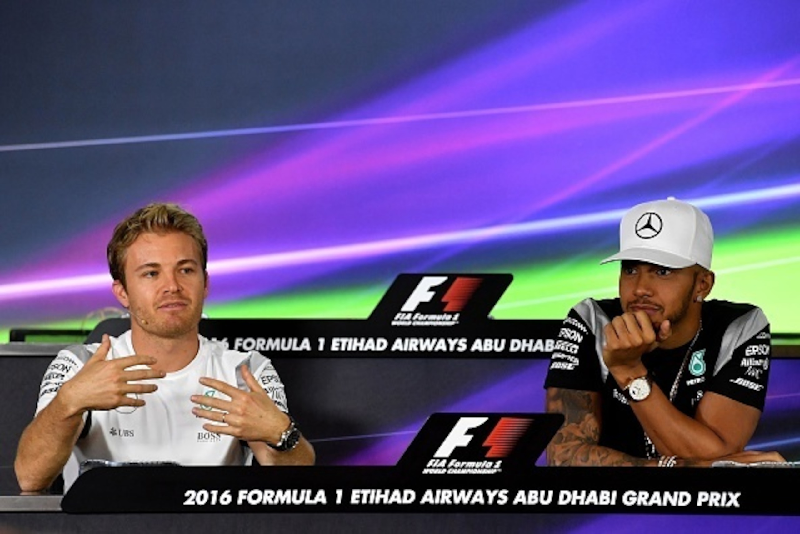 Mercedes AMG Petronas F1 Team's German driver Nico Rosberg (L) and British driver Lewis Hamilton attend the drivers press conference ahead of the Abu Dhabi Formula One Grand Prix at the Yas Marina circuit on November 24, 2016.  / AFP / ANDREJ ISAKOVIC    