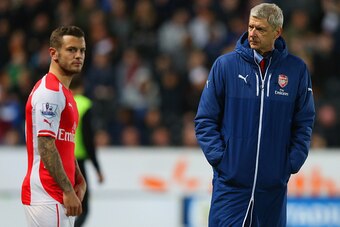 HULL, ENGLAND - MAY 04:  Arsene Wenger manager of Arsenal looks on as Jack Wilshere of Arsenal prepares to come onto the pitch during the Barclays Premier League match between Hull City and Arsenal at KC Stadium on May 4, 2015 in Hull, England.  (Photo by