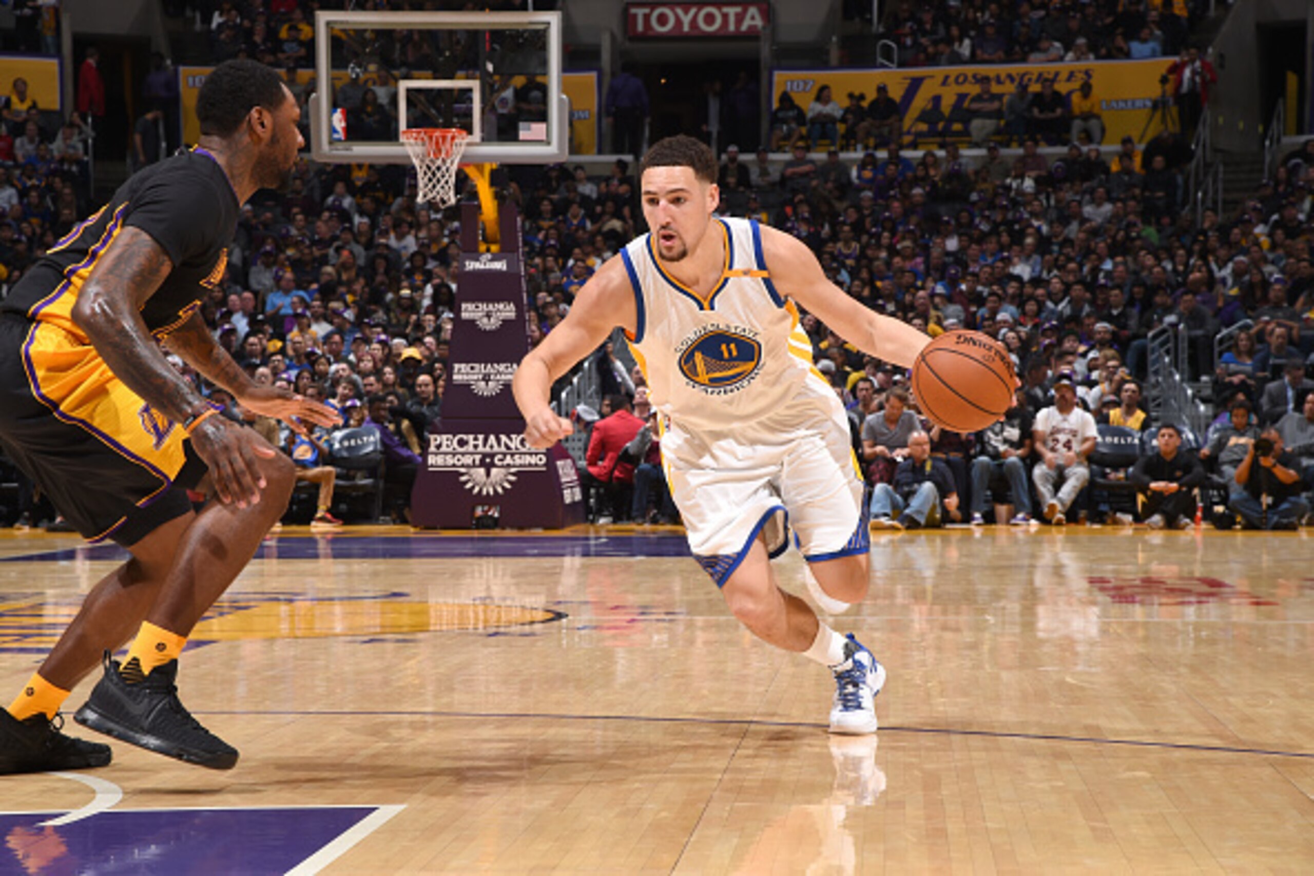 LOS ANGELES, CA - NOVEMBER 25: Klay Thompson #11 of the Golden State Warriors drives to the basket against the Los Angeles Lakers on November 25, 2016 at STAPLES Center in Los Angeles, California. NOTE TO USER: User expressly acknowledges and agrees that,