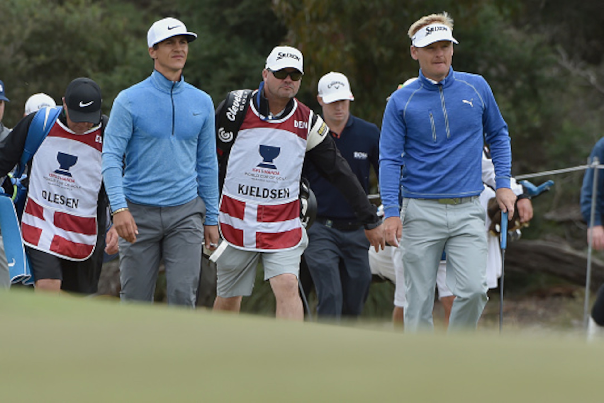 Thorbjorn Olesen (L) and Soren Kjeldsen (R) of Denmark head for the green during the second day of the World Cup of Golf on the Kingston Heath course in Melbourne on November 25, 2016. / AFP / PAUL CROCK / IMAGE RESTRICTED TO EDITORIAL USE - STRICTLY NO C