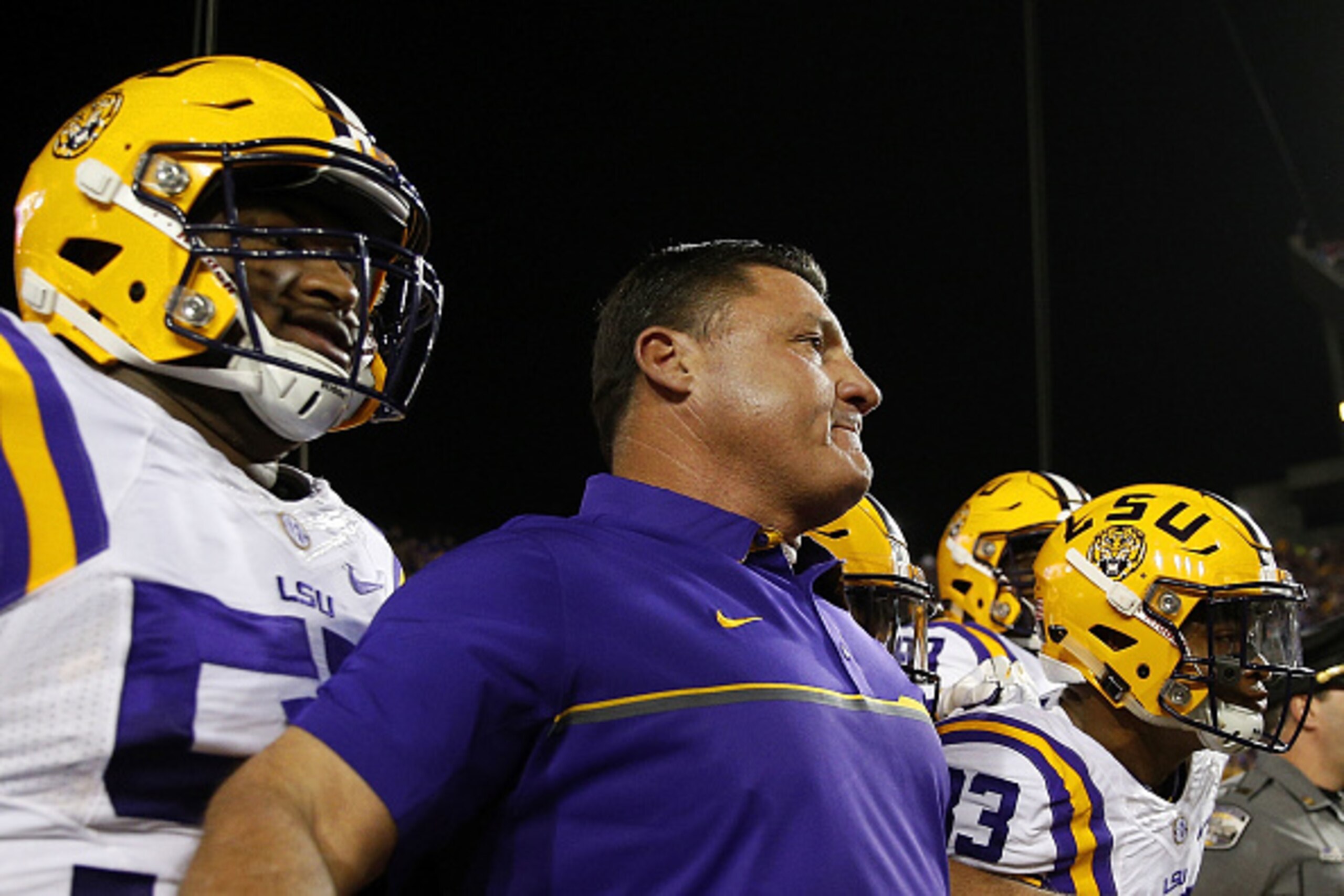 BATON ROUGE, LA - OCTOBER 22:  Head coach Ed Orgeron of the LSU Tigers leads his team on the field before a game against the Mississippi Rebels at Tiger Stadium on October 22, 2016 in Baton Rouge, Louisiana.  (Photo by Jonathan Bachman/Getty Images)