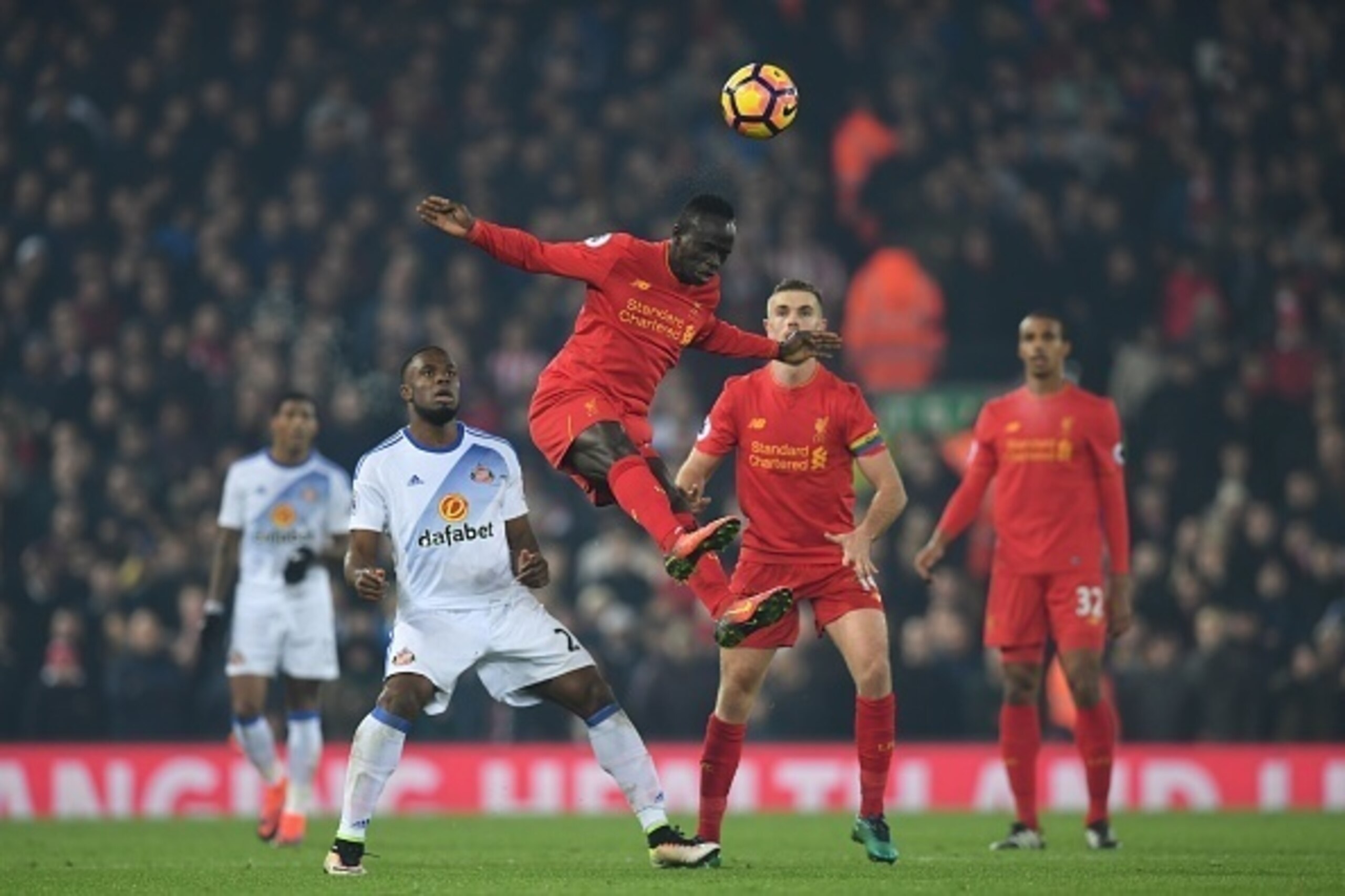 Liverpool's Senegalese midfielder Sadio Mane heads the ball during the English Premier League football match between Liverpool and Sunderland at Anfield in Liverpool, north west England on November 26, 2016. / AFP / Paul ELLIS / RESTRICTED TO EDITORIAL US