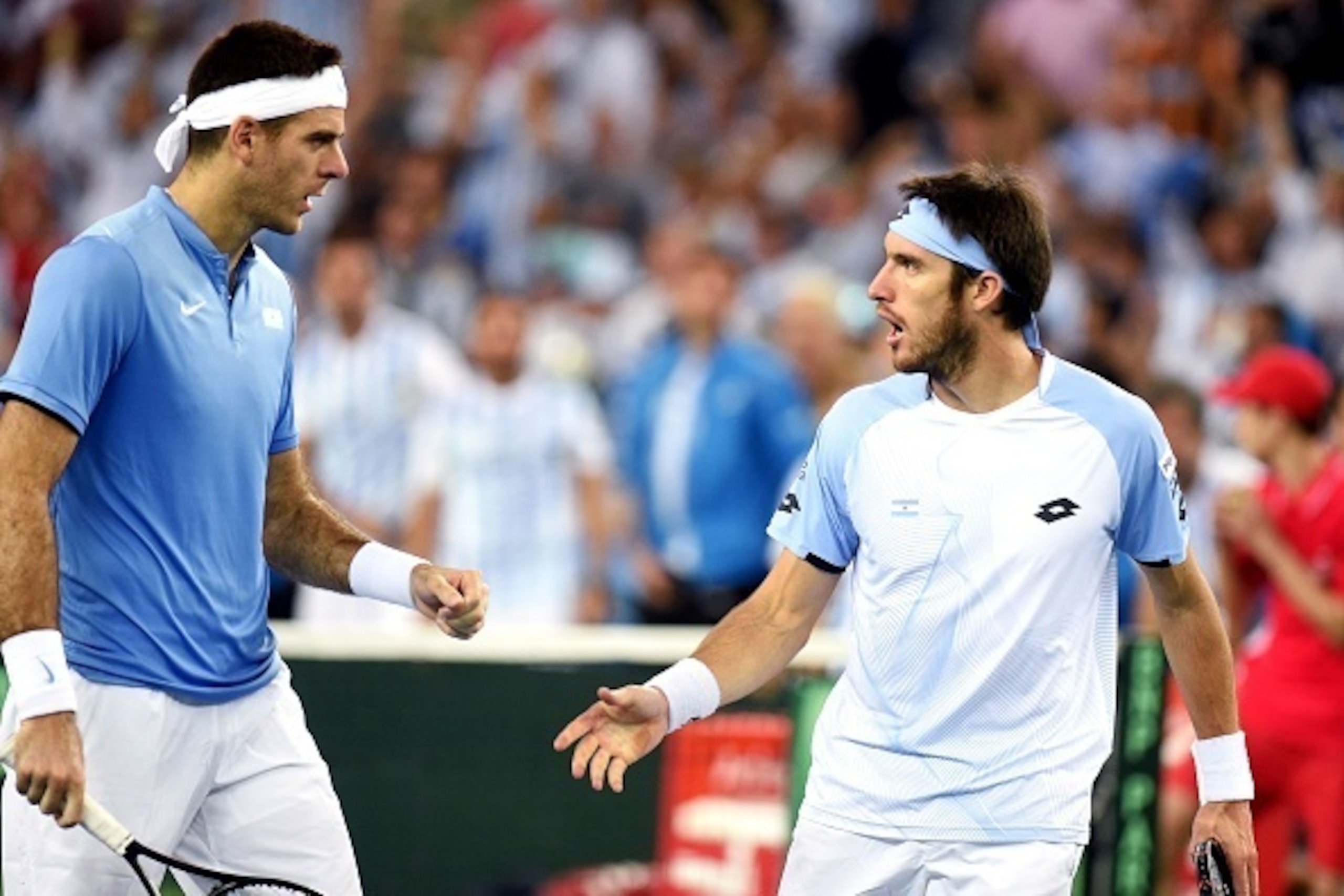 Argentina's Leonardo Mayer (R) and Juan Martin del Potro react as they compete against Croatia's Ivan Dodig and Marin Cilic  during the Davis Cup World Group final doubles match between Croatia and Argentina at Arena hall in Zagreb, on November 26, 2016. 