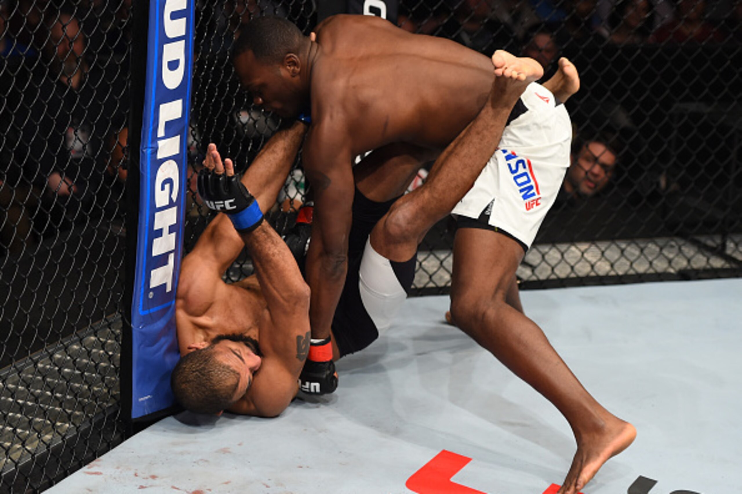 PITTSBURGH, PA - FEBRUARY 21:  Derek Brunson (top) punches Roan Carneiro in their middleweight bout during the UFC Fight Night event at Consol Energy Center on February 21, 2016 in Pittsburgh, Pennsylvania. (Photo by Jeff Bottari/Zuffa LLC/Zuffa LLC via G