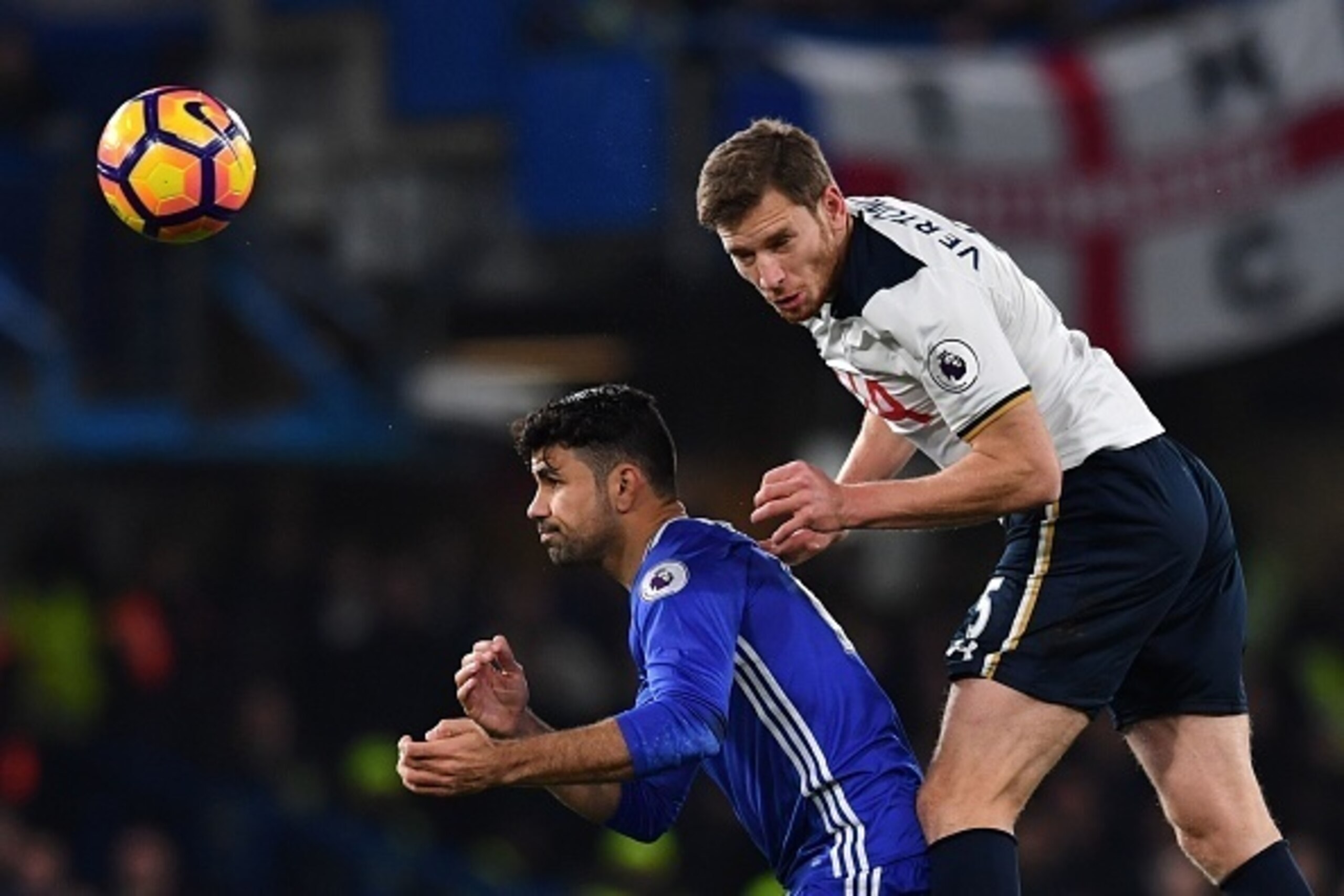Tottenham Hotspur's Belgian defender Jan Vertonghen (R) climbs above Chelsea's Brazilian-born Spanish striker Diego Costa (L) to head the ball during the English Premier League football match between Chelsea and Tottenham Hotspur at Stamford Bridge in Lon