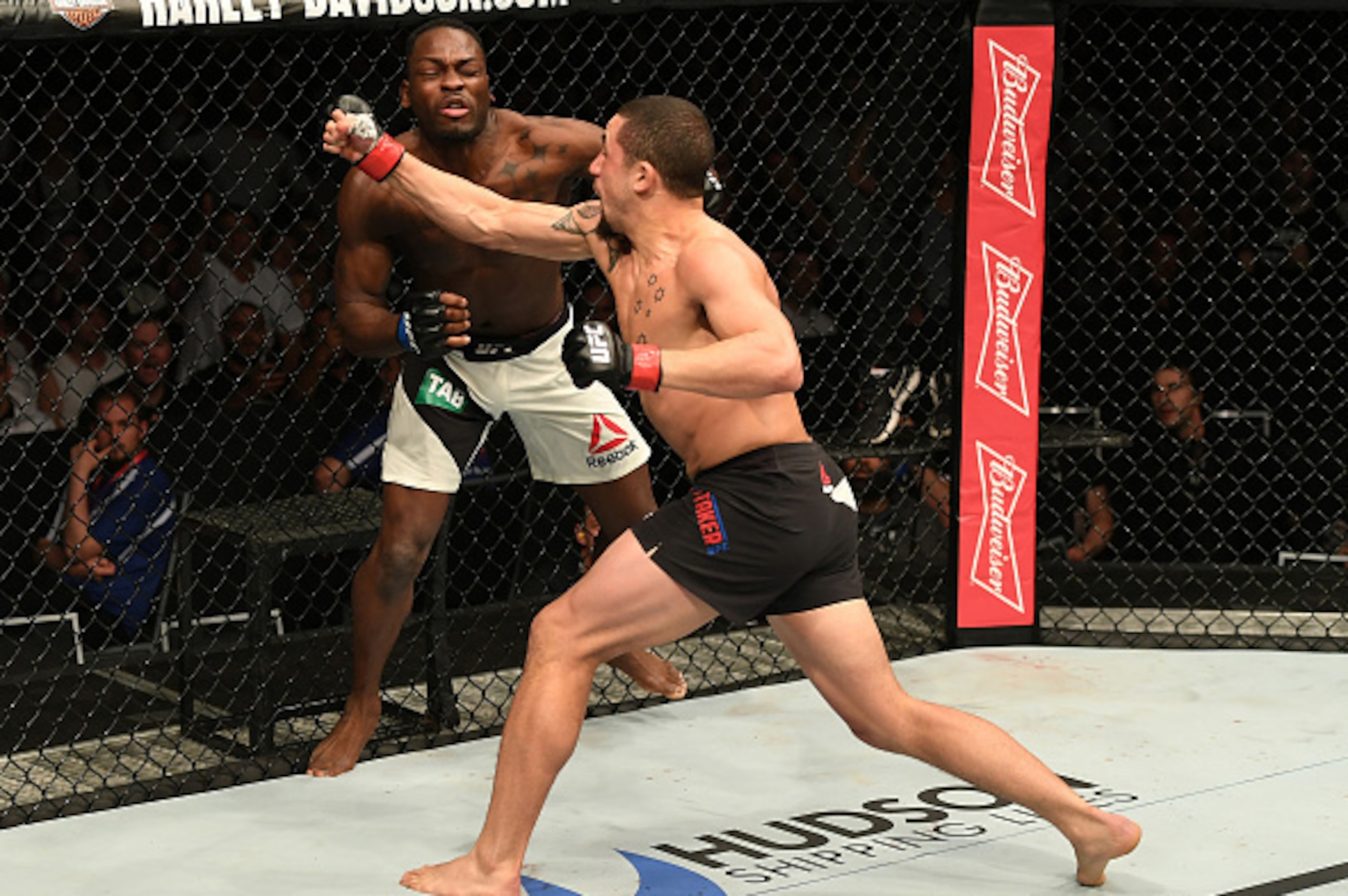 MELBOURNE, AUSTRALIA - NOVEMBER 27: (R-L) Robert Whittaker of New Zealand punches Derek Brunson in their middleweight bout during the UFC Fight Night event at Rod Laver Arena on November 27, 2016 in Melbourne, Australia. (Photo by Jeff Bottari/Zuffa LLC MELBOURNE, AUSTRALIA - NOVEMBER 27: (R-L) Robert Whittaker of New Zealand punches Derek Brunson in their middleweight bout during the UFC Fight Night event at Rod Laver Arena on November 27, 2016 in Melbourne, Australia. (Photo by Jeff Bottari/Zuffa LLC