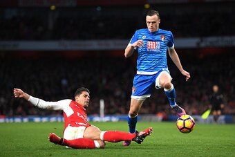 LONDON, ENGLAND - NOVEMBER 27: Gabriel of Arsenal (L) tackles Brad Smith of AFC Bournemouth (R) during the Premier League match between Arsenal and AFC Bournemouth at Emirates Stadium on November 27, 2016 in London, England.  (Photo by Shaun Botterill/Get