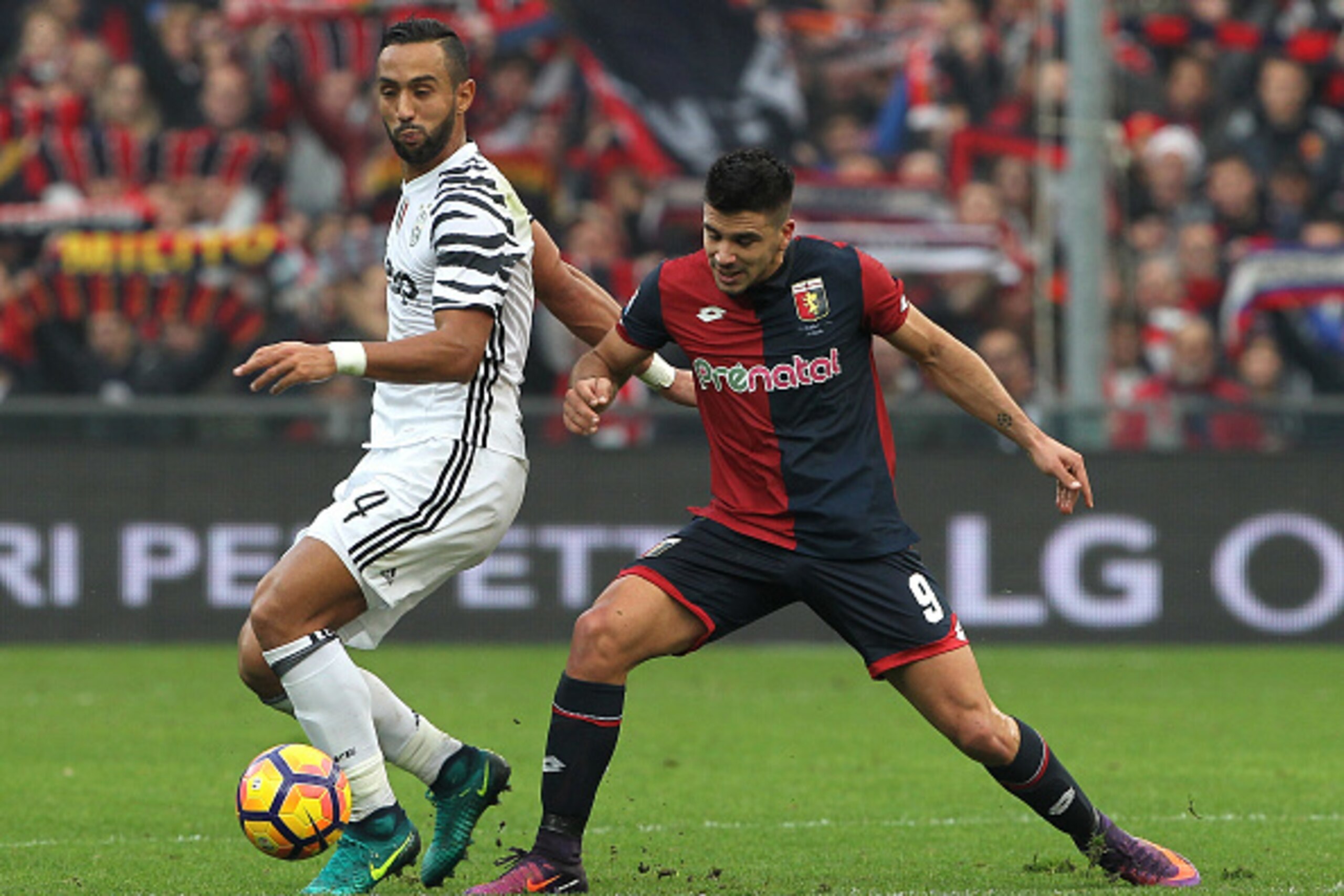 GENOA, ITALY - NOVEMBER 27:  Medhi Benatia of Juventus FC competes for the ball with Giovanni Simeone of Genoa CFC during the Serie A match between Genoa CFC and Juventus FC at Stadio Luigi Ferraris on November 27, 2016 in Genoa, Italy.  (Photo by Marco L