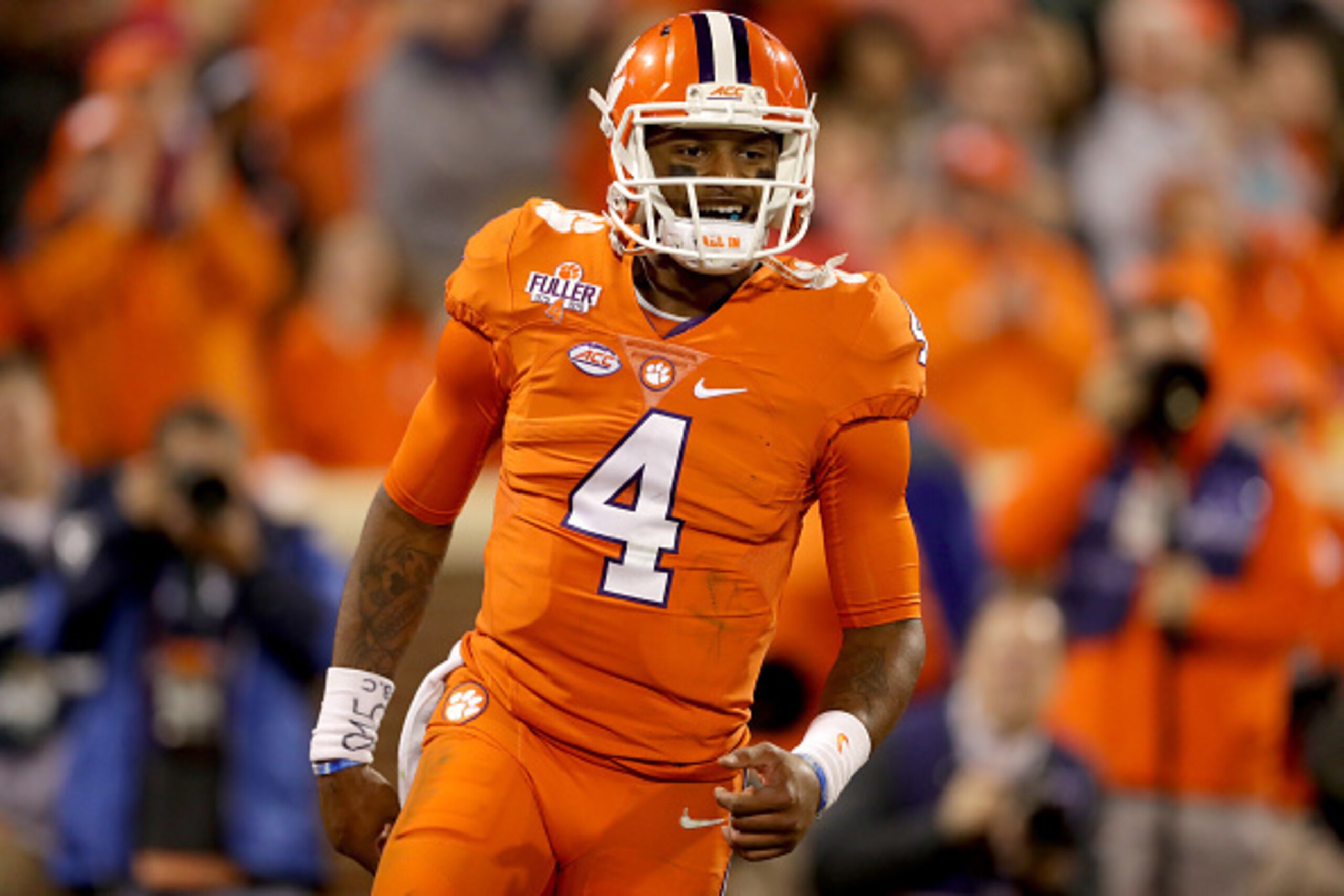 CLEMSON, SC - NOVEMBER 26: Deshaun Watson #4 of the Clemson Tigers celebrates after throwing a touchdown pass against the South Carolina Gamecocks during their game at Memorial Stadium on November 26, 2016 in Clemson, South Carolina. (Photo by Streeter CLEMSON, SC - NOVEMBER 26: Deshaun Watson #4 of the Clemson Tigers celebrates after throwing a touchdown pass against the South Carolina Gamecocks during their game at Memorial Stadium on November 26, 2016 in Clemson, South Carolina. (Photo by Streeter