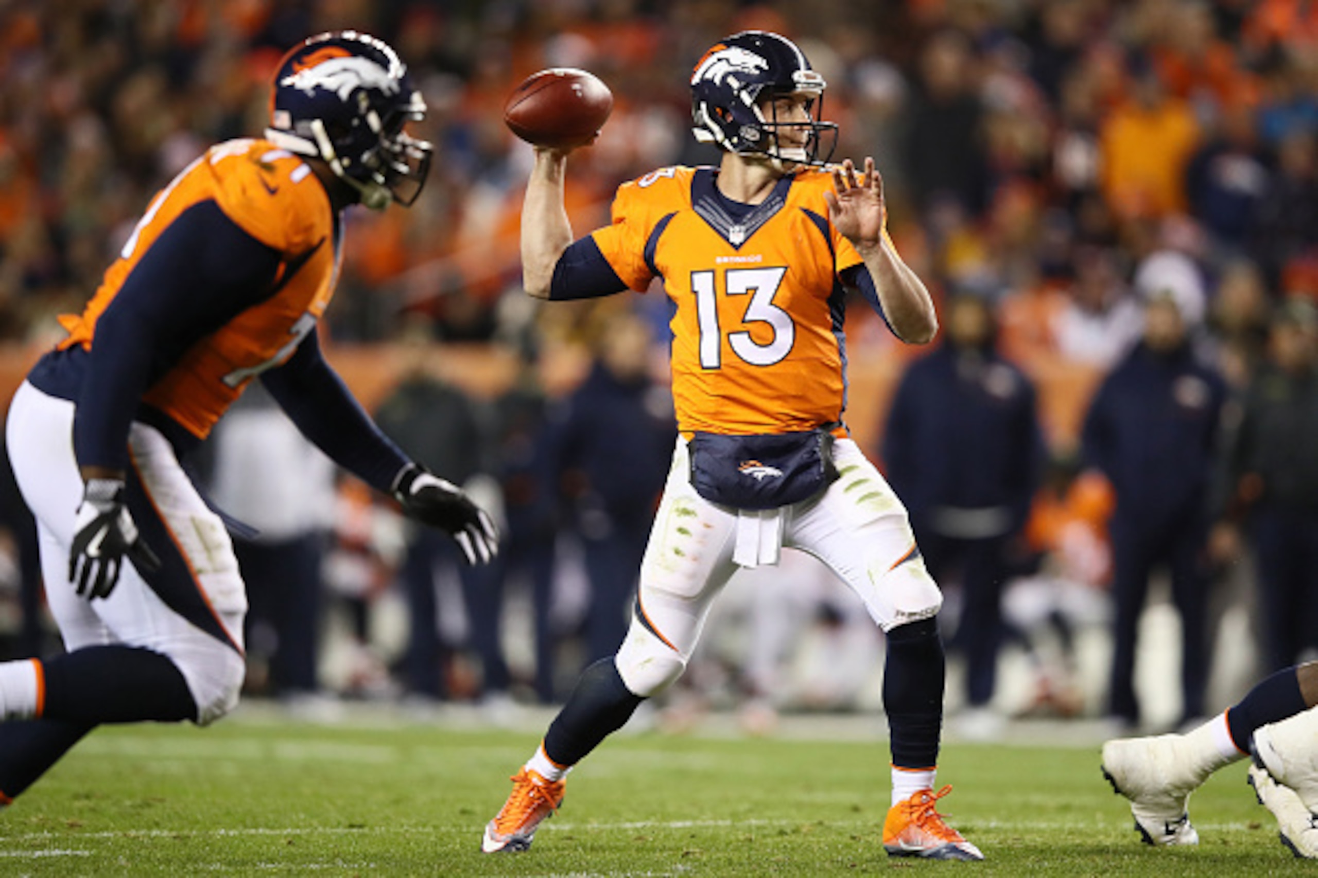 DENVER, CO - NOVEMBER 27:  Quarterback Trevor Siemian #13 of the Denver Broncos passes in the second quarter of the game against the Kansas City Chiefs at Sports Authority Field at Mile High on November 27, 2016 in Denver, Colorado. (Photo by Ezra Shaw/Ge