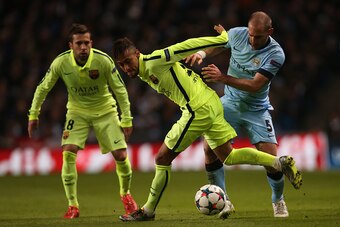 MANCHESTER, ENGLAND - FEBRUARY 24:  Neymar of Barcelona vies with Manchester City's Argentinian defender Pablo Zabaleta during the UEFA Champions League Round of 16  football match between Manchester City and Barcelona at The Etihad Stadium on February 24