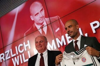 Hoeness' dinner table demeanour convinced Guardiola (right) to join Bayern.