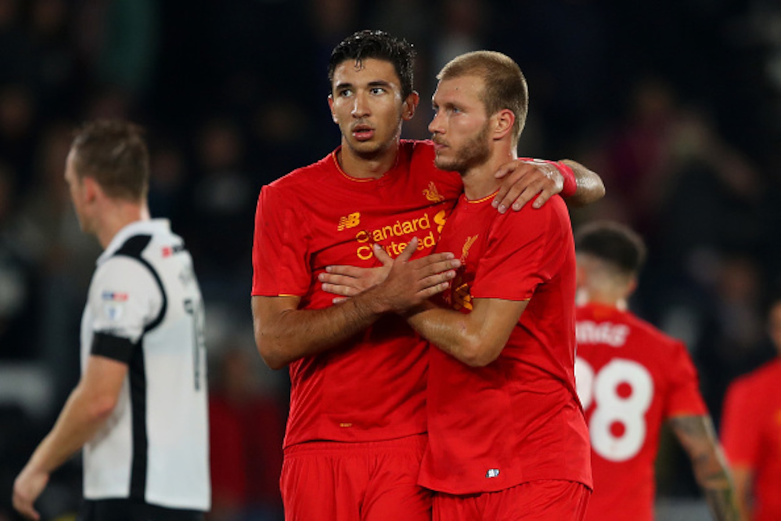 DERBY, ENGLAND - SEPTEMBER 20:  Ragnar Klavan of Liverpool and Marko Grujic of Liverpool celebrate victory during the EFL Cup Third Round match between Derby County and Liverpool at iPro Stadium on September 20, 2016 in Derby, England.  (Photo by Richard 