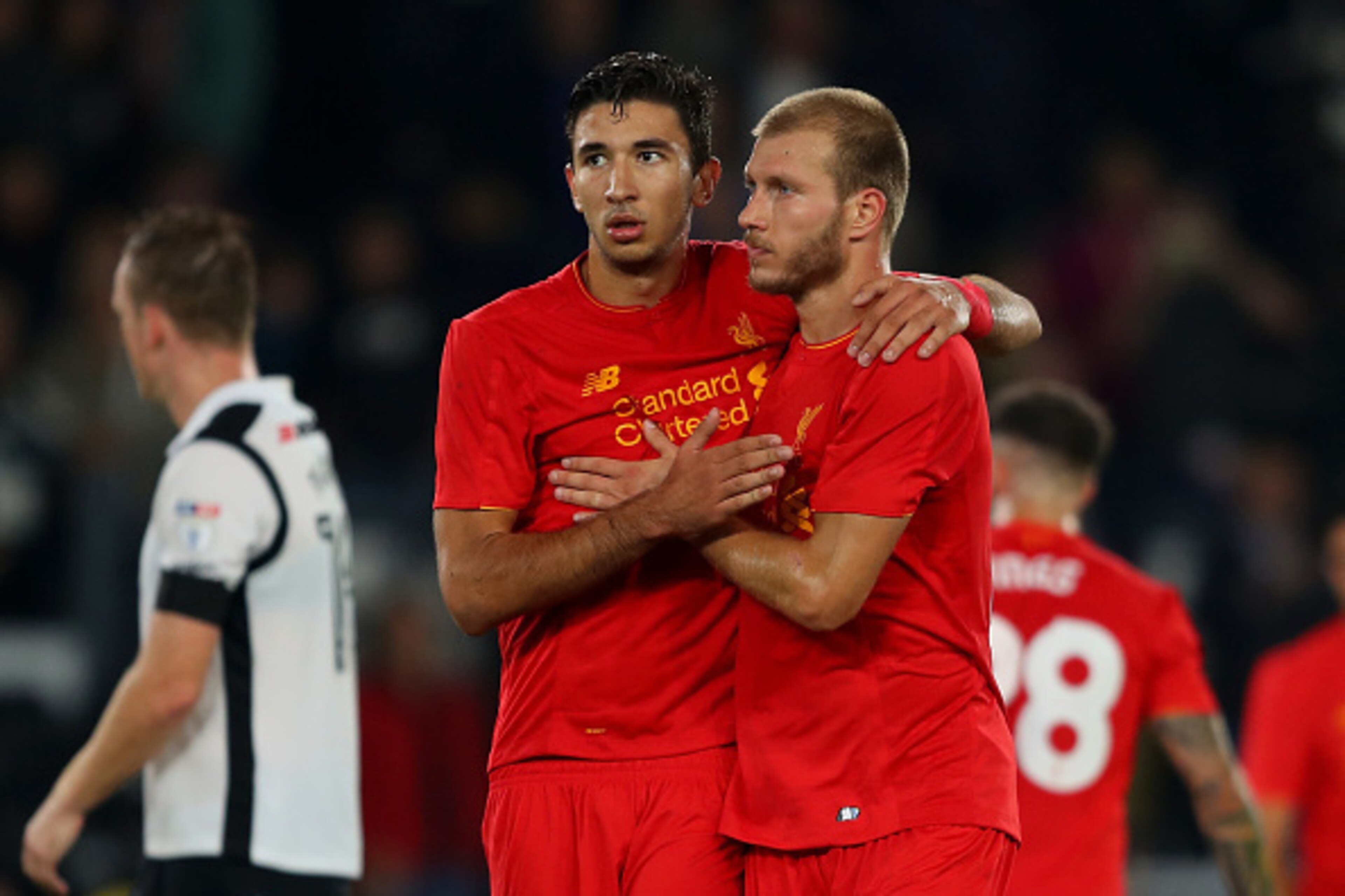 DERBY, ENGLAND - SEPTEMBER 20:  Ragnar Klavan of Liverpool and Marko Grujic of Liverpool celebrate victory during the EFL Cup Third Round match between Derby County and Liverpool at iPro Stadium on September 20, 2016 in Derby, England.  (Photo by Richard 